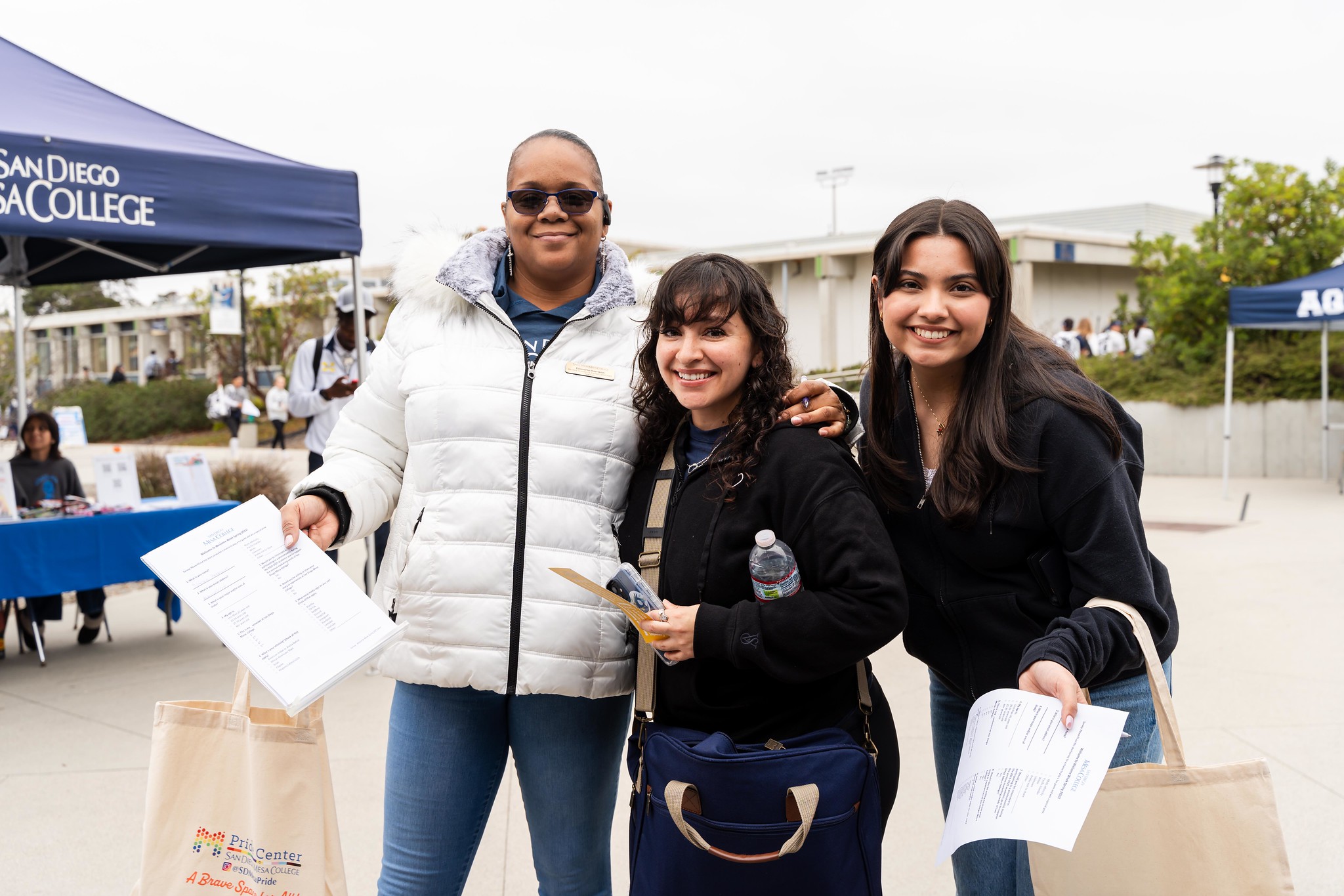 
Three ladies at Mesa College's welcome week.
