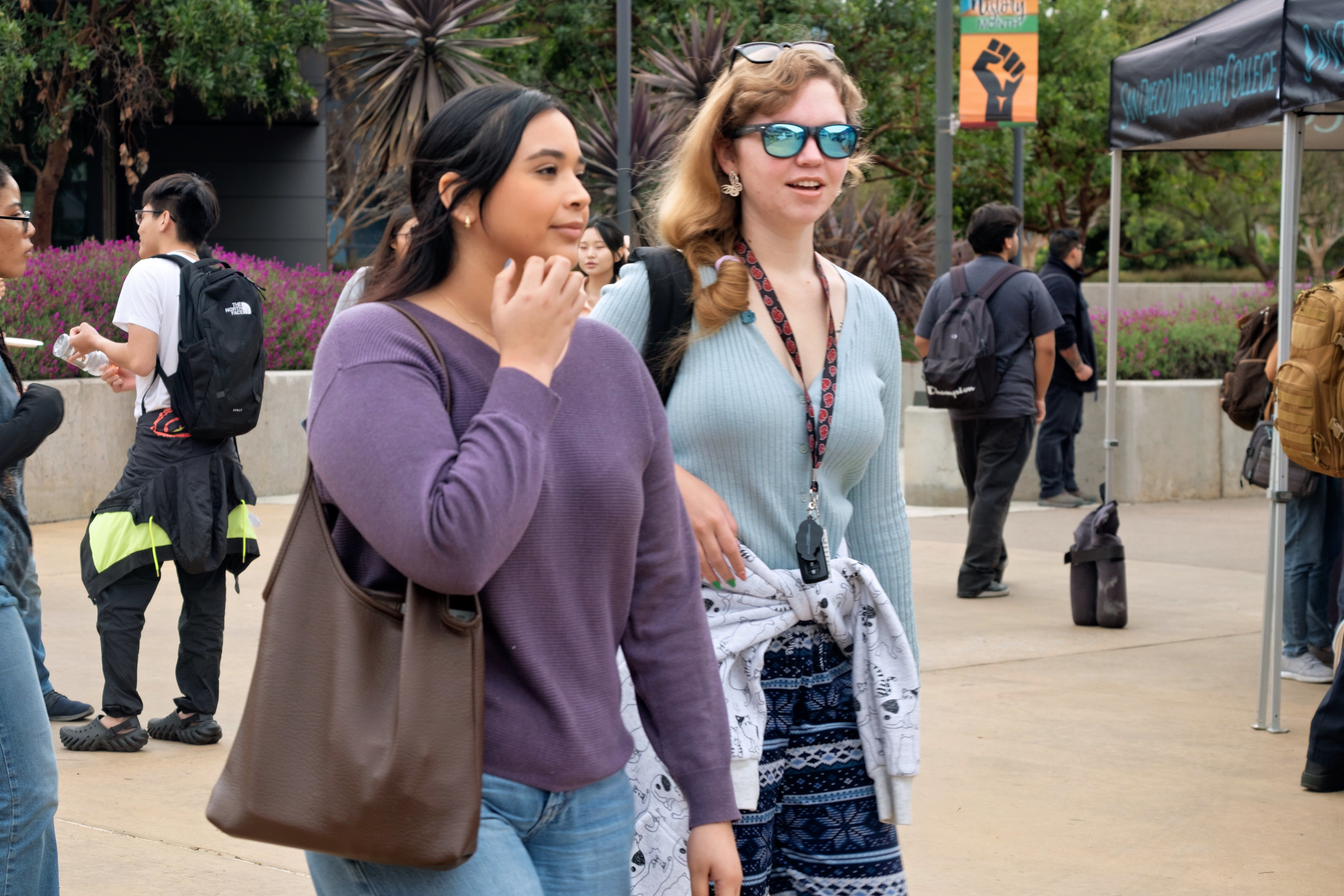 
Two ladies wearing backpacks at Miramar College.
