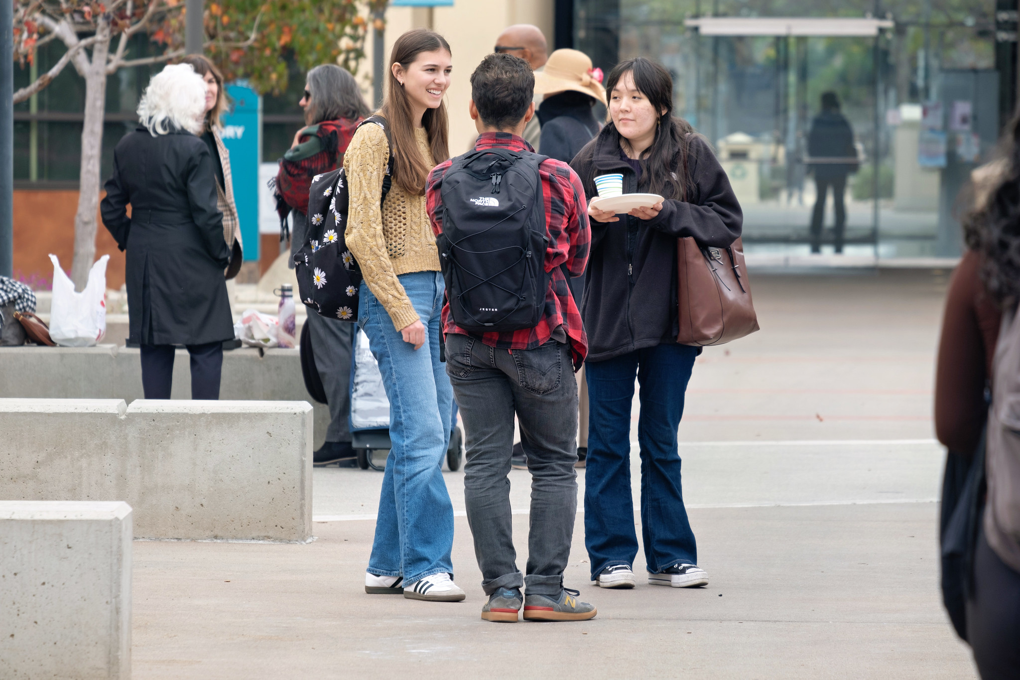 
A group of students talking at Miramar College.
