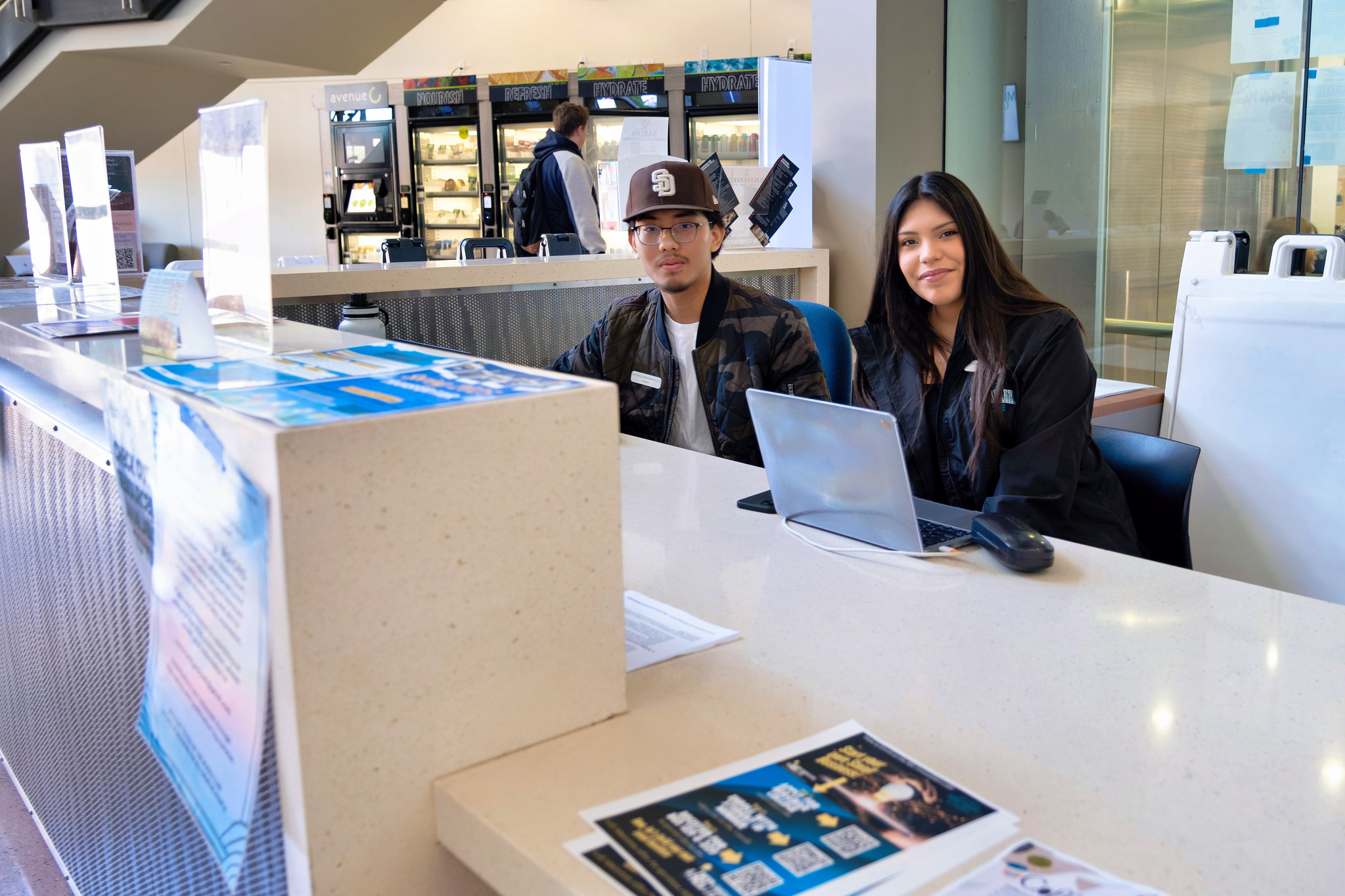 
Two students work the information desk at Miramar College.
