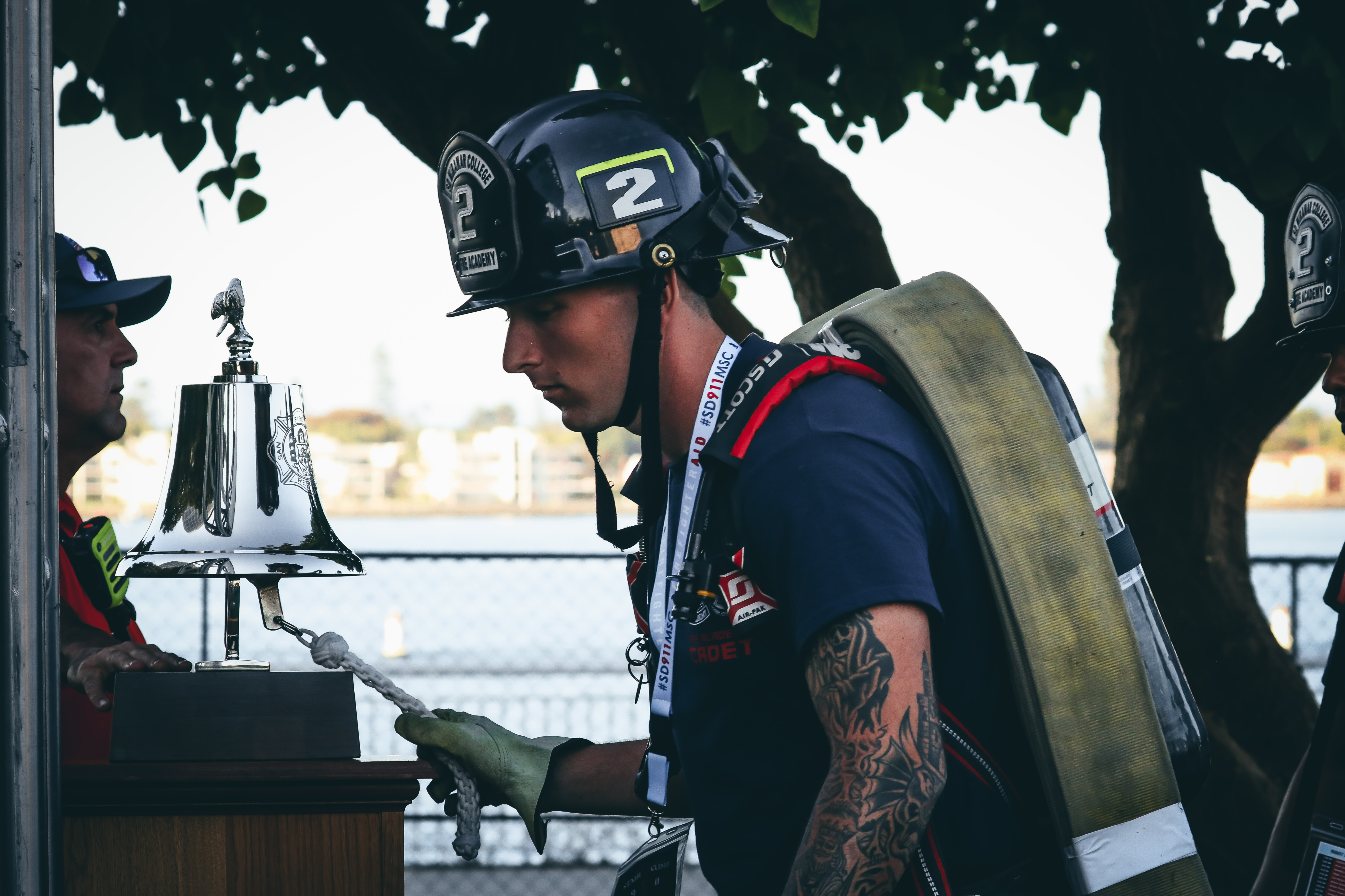 
A cadet rings a silver bell in honor of the fallen firefighters.&nbsp;
