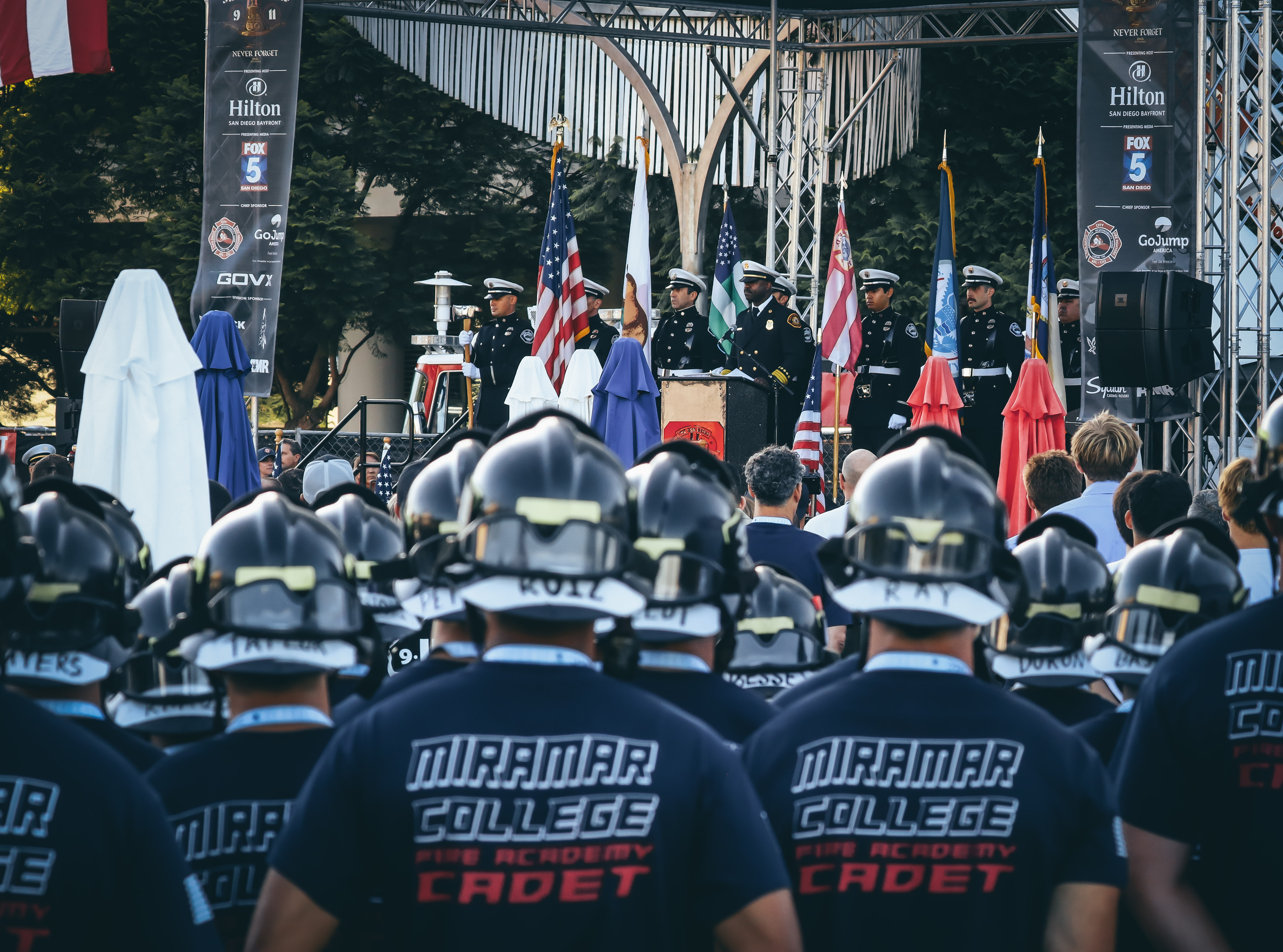 
Fire offials on stage speak to the participants in the stair climb.&nbsp;
