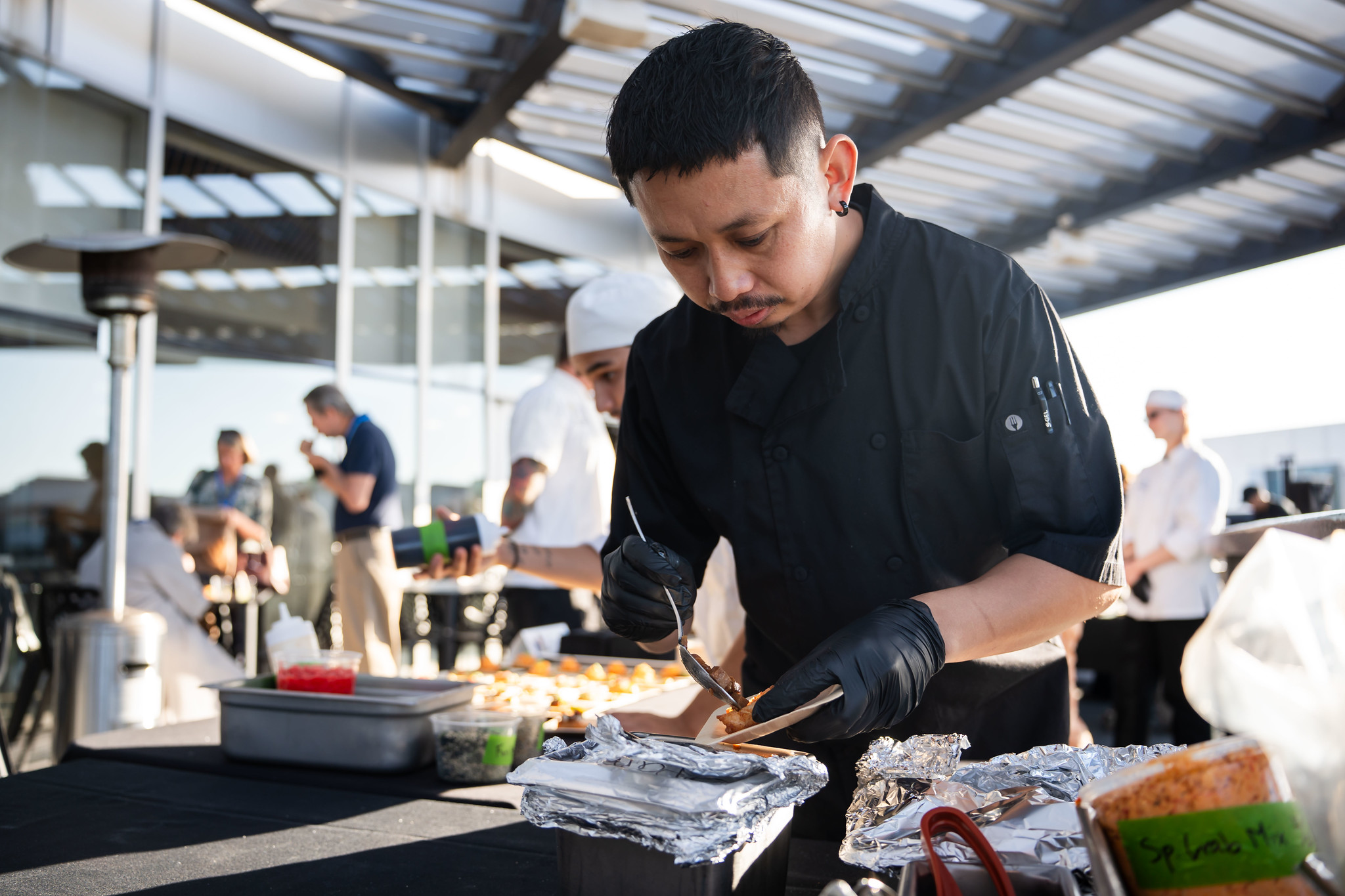
A chef preparing samples.
