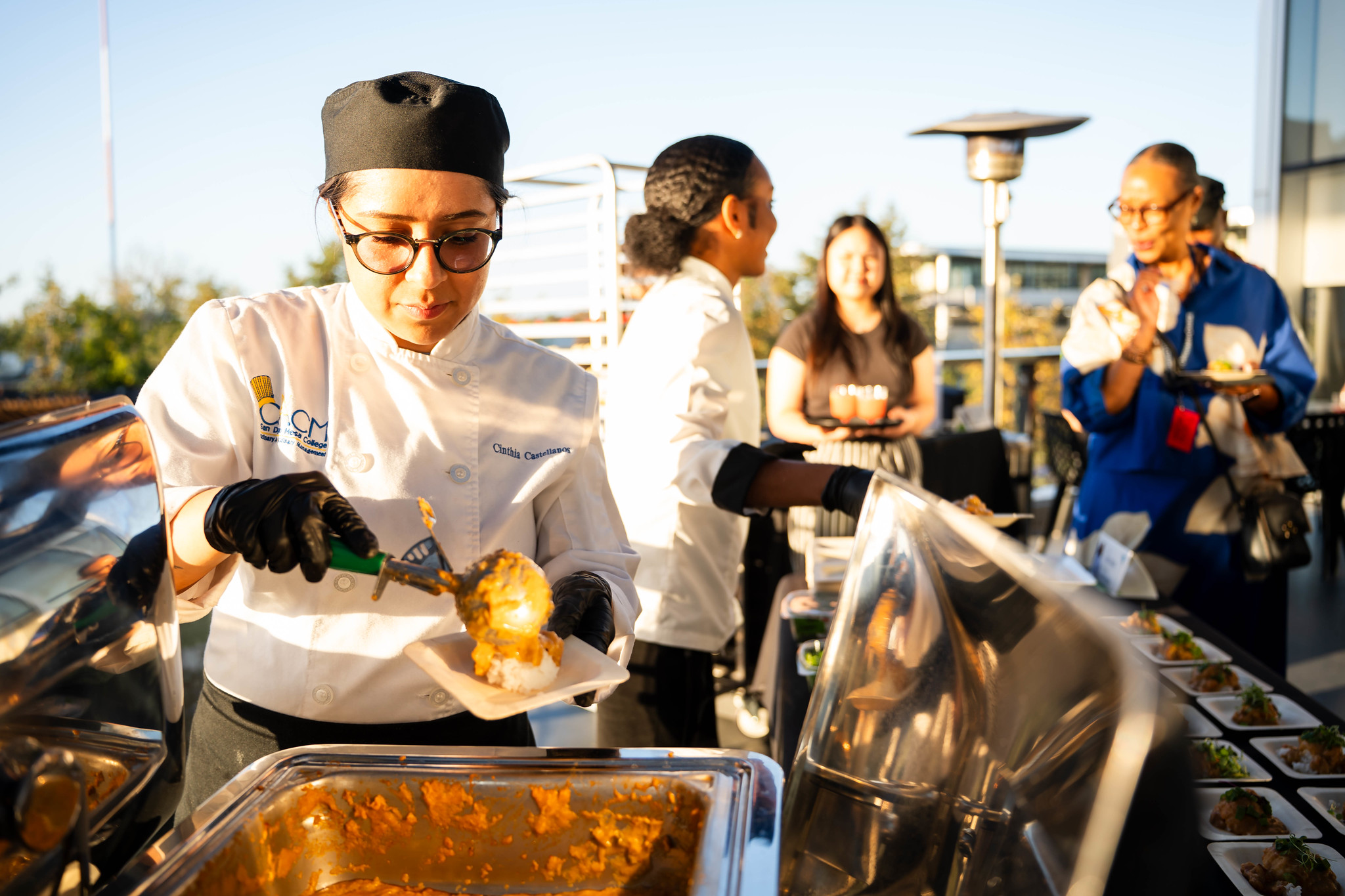 
A chef preparing samples.
