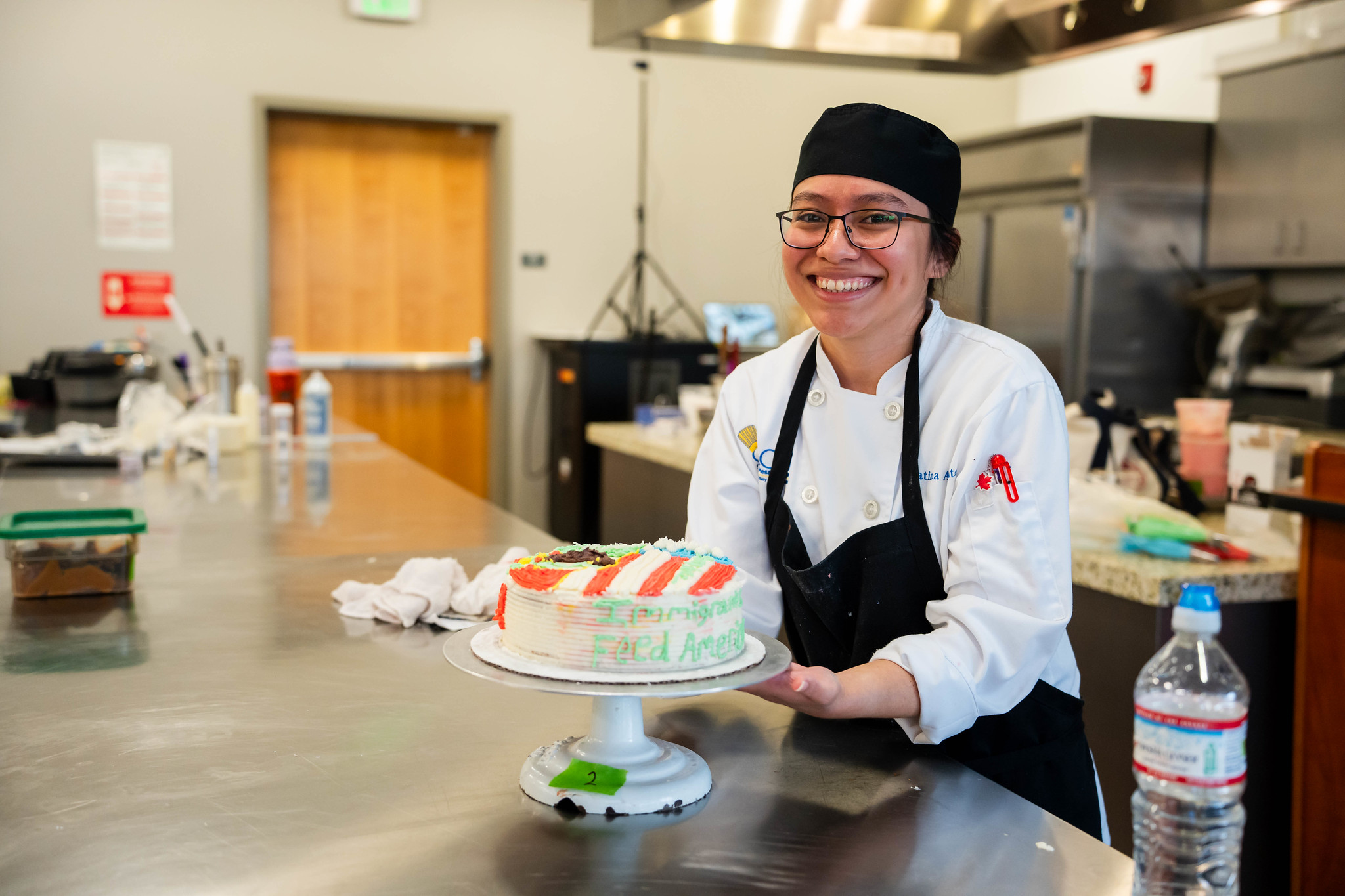 
A chef shows off her decorated cake.

