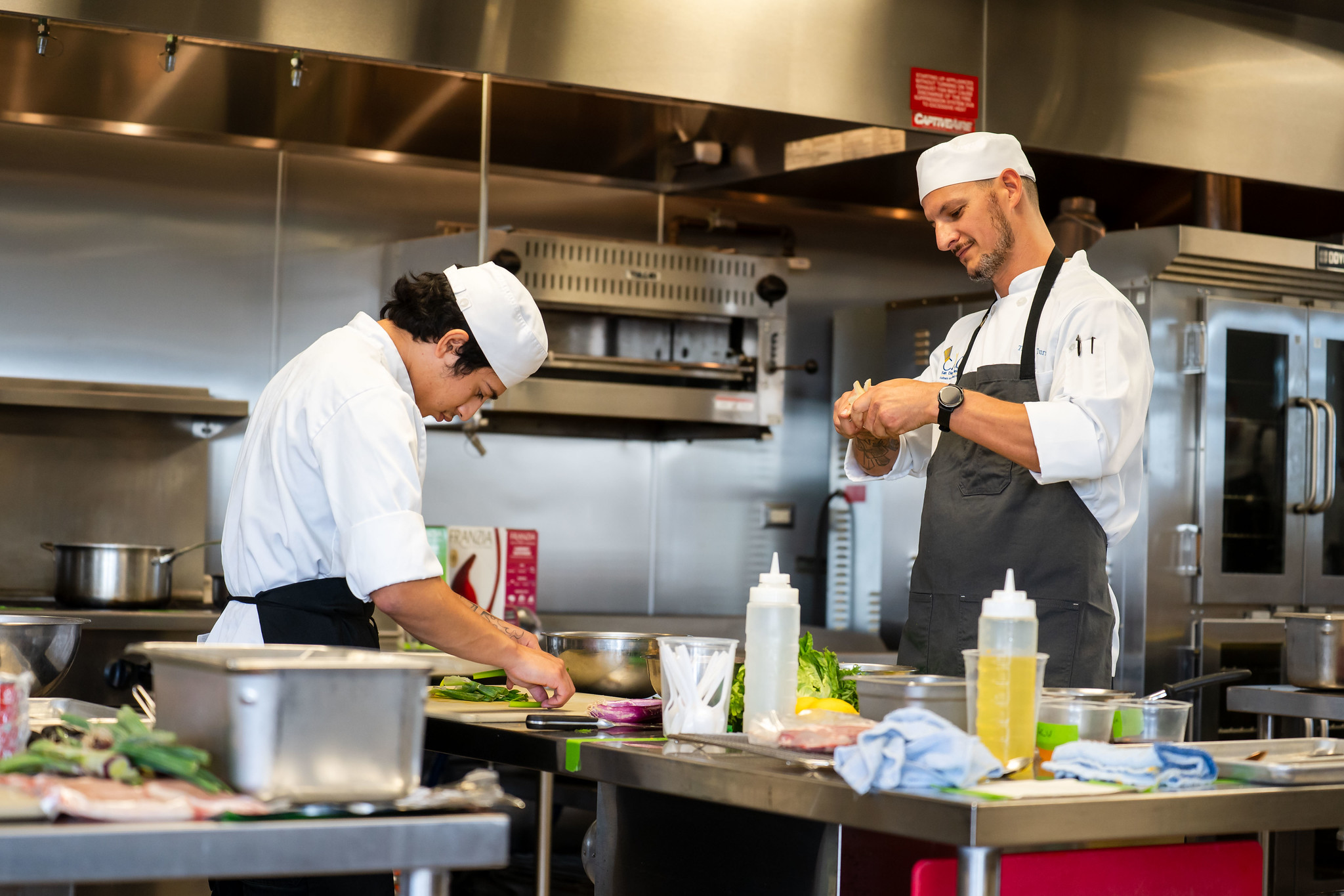 
Two chefs working in the prep area.
