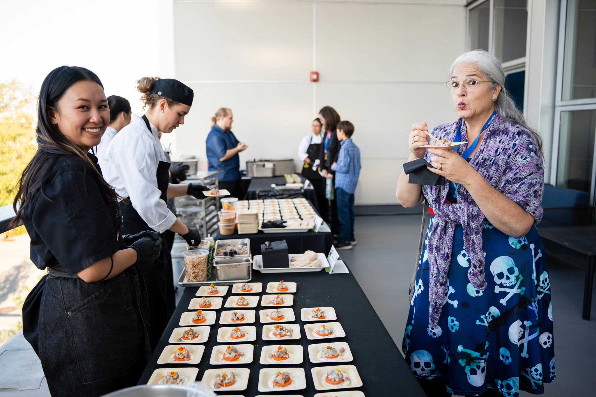 
A guest enjoys a sample from one the food stations.
