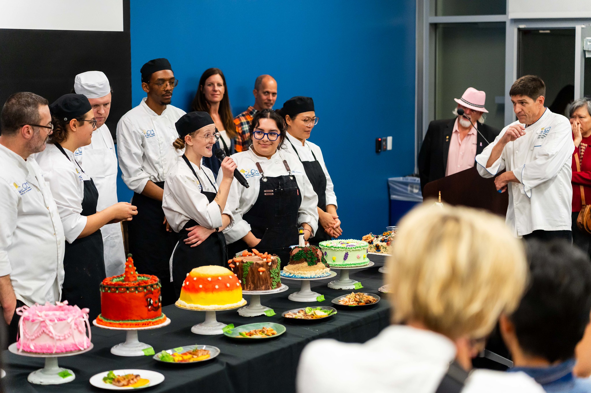 
One of the chefs talks about her cake. 
