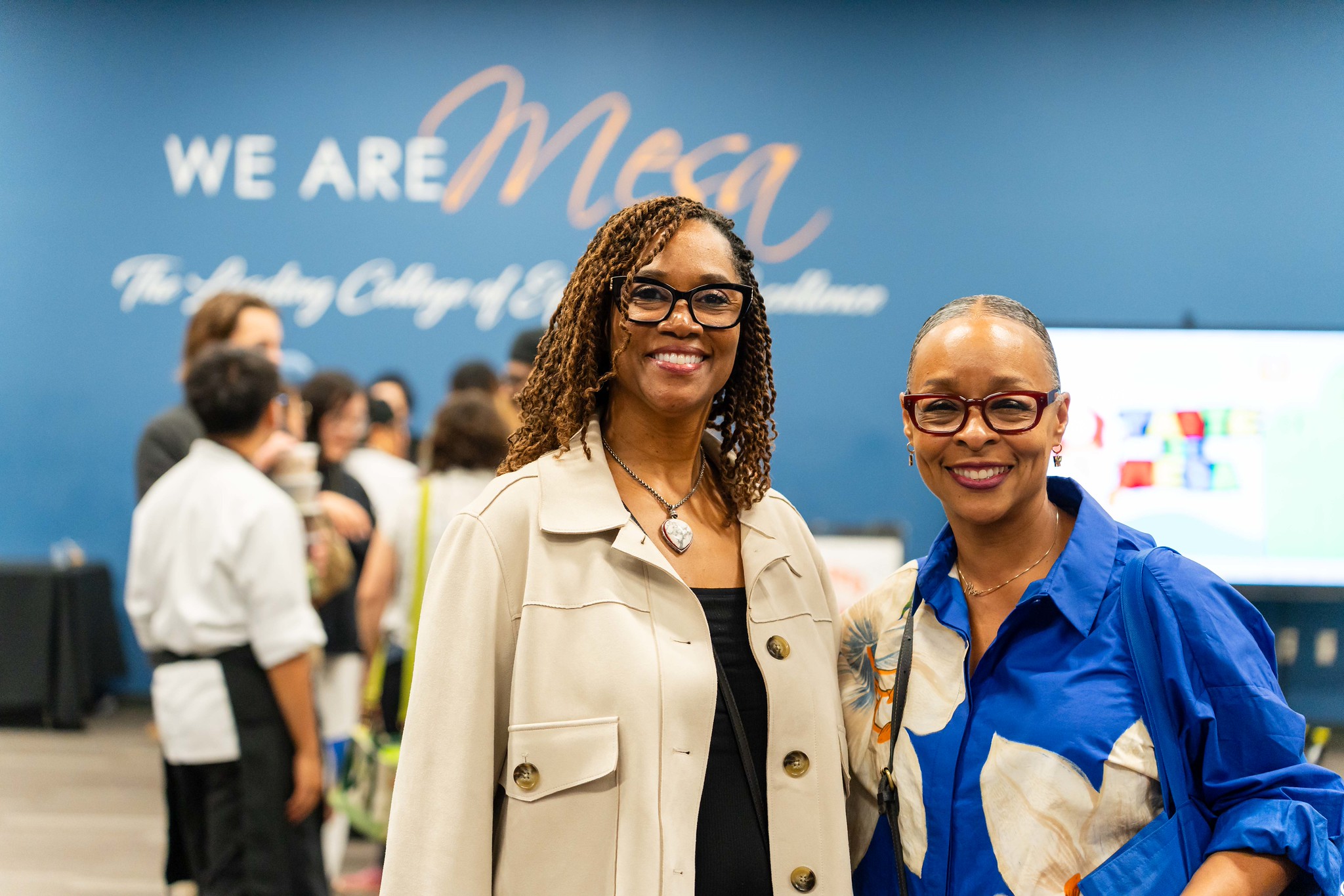 
Dr. Ashanti Hands with a guest at Taste of Mesa.
