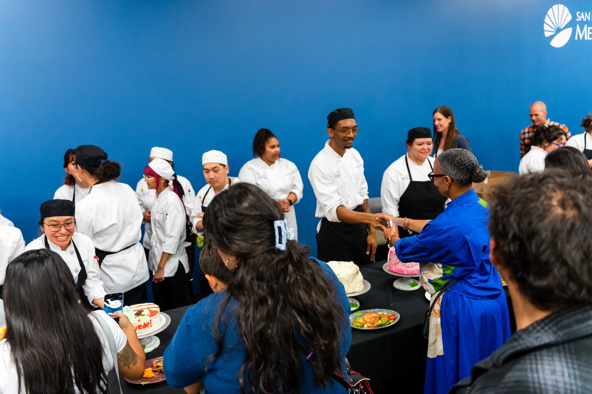 
Mesa College President Ashanti Hands meets the bakers. 
