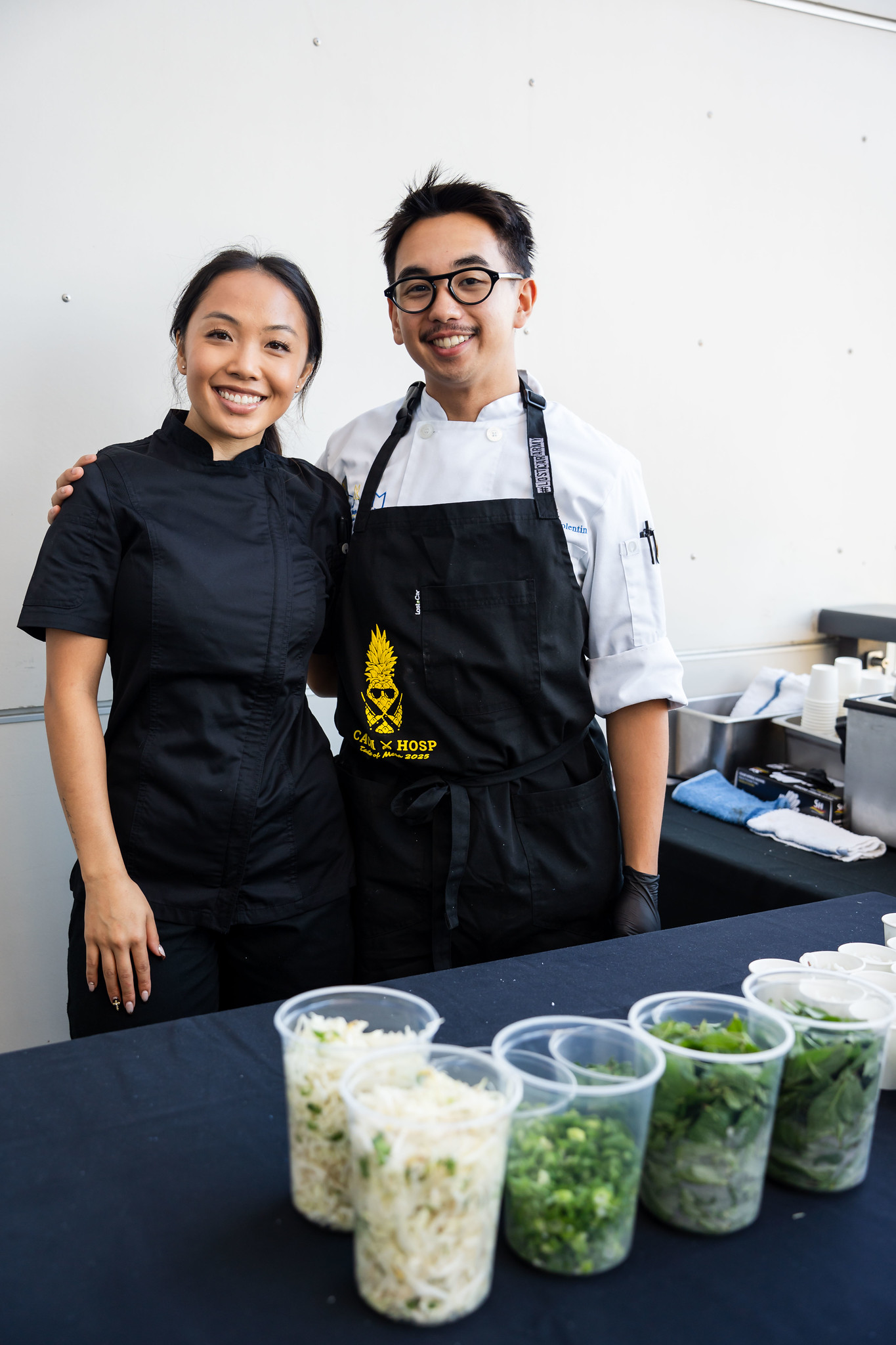 
Two chefs at a serving station

