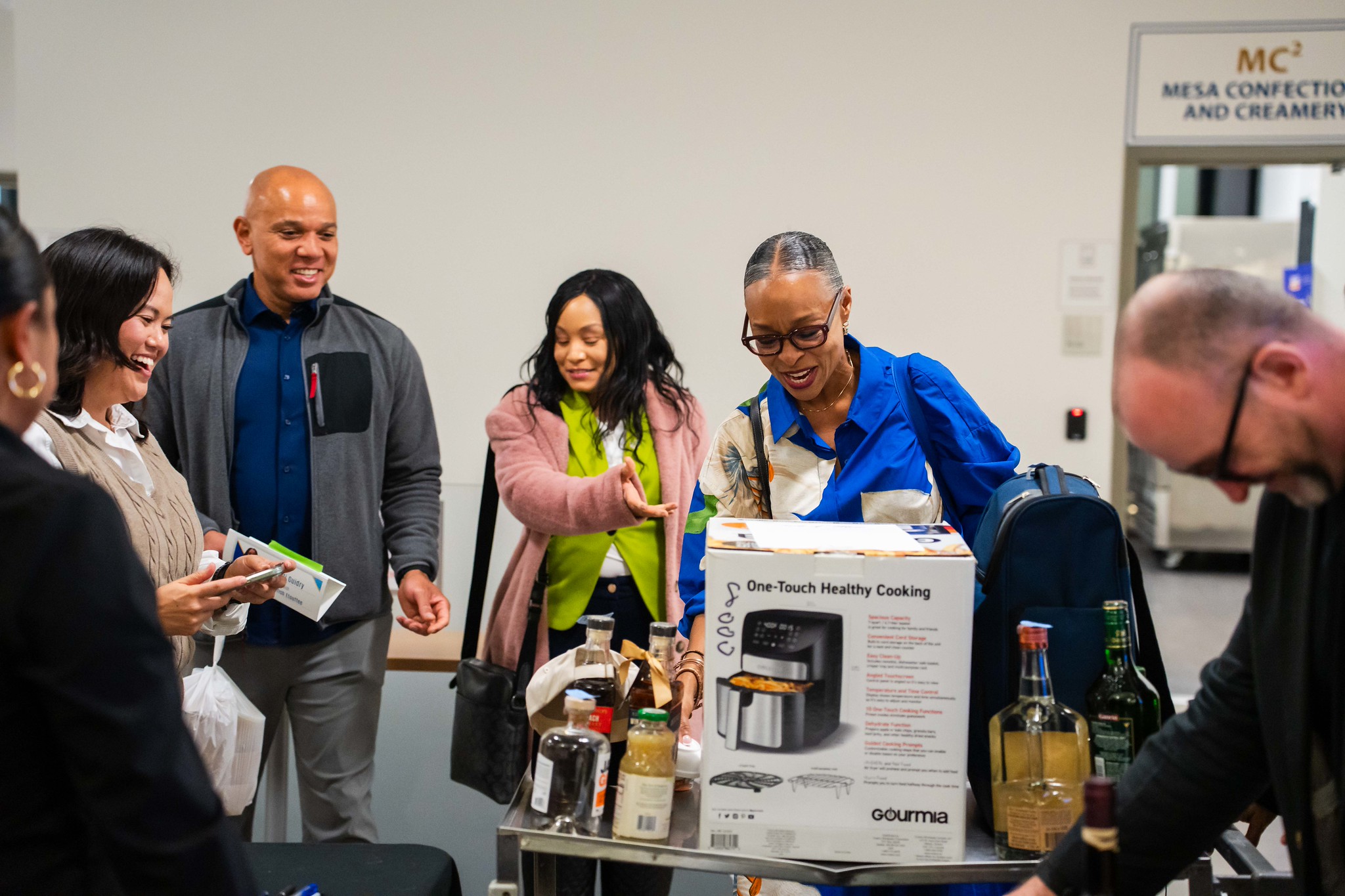 
Dr. Ashanti Hands looks at the air fryer that was given away as a prize.
