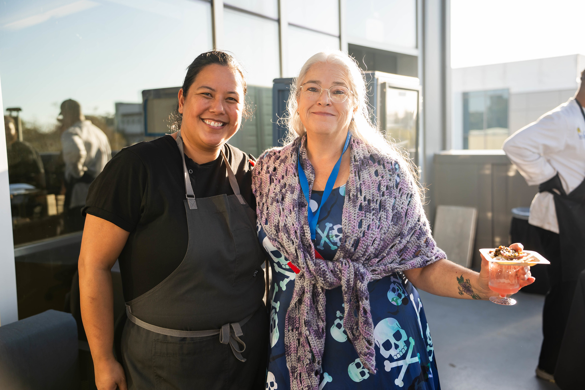 
A guest and a chef on the balcony at Taste of Mesa. 
