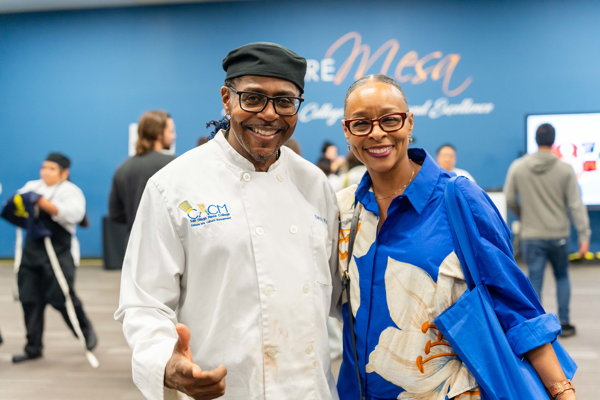 
Dr. Ashanti Hands with a chef. 
