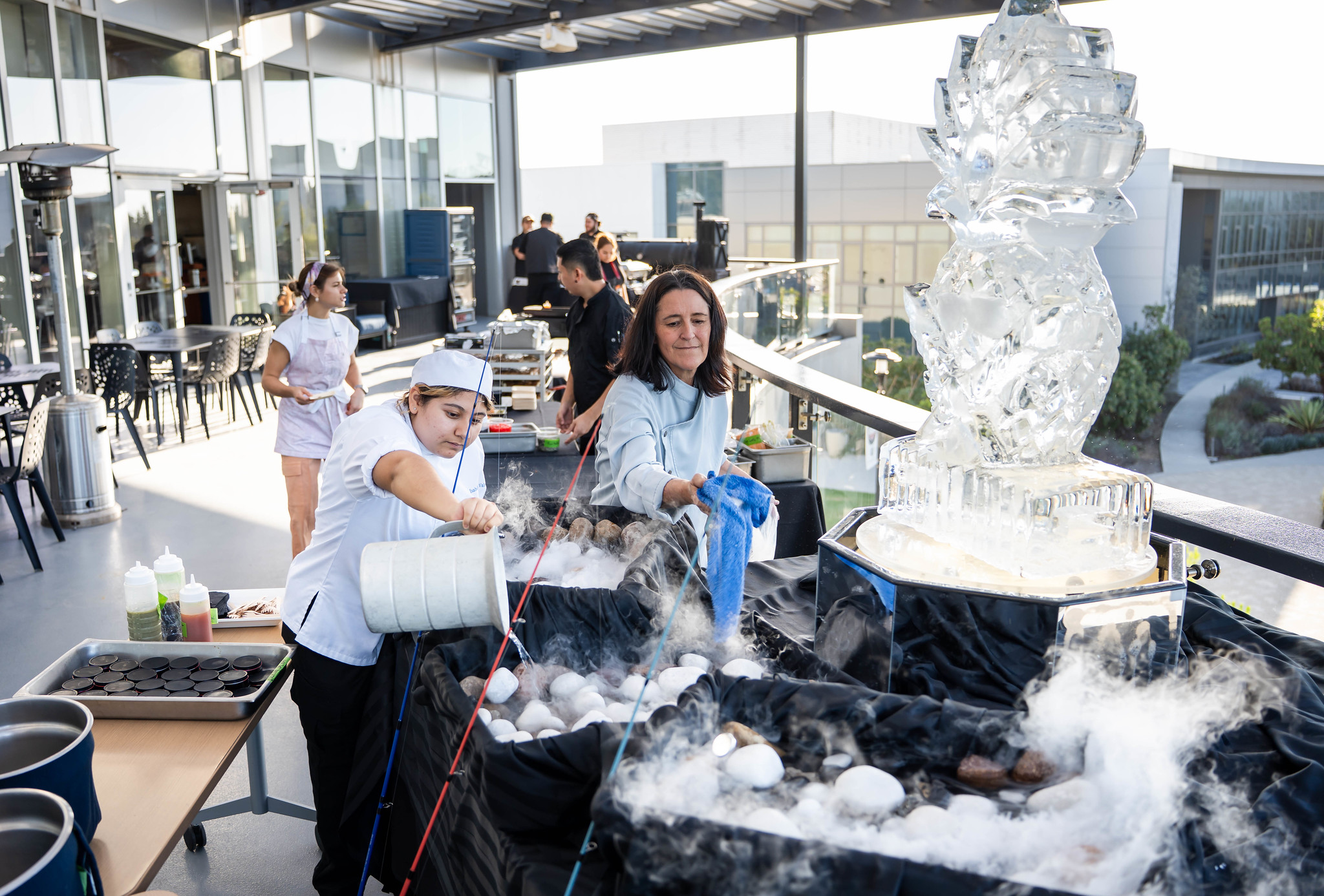 
An ice sculpture near a display table.
