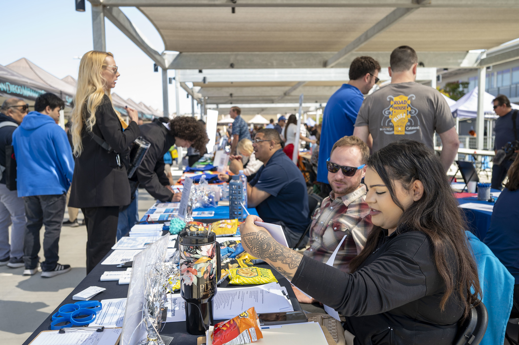 Students stop by a career fair booth.