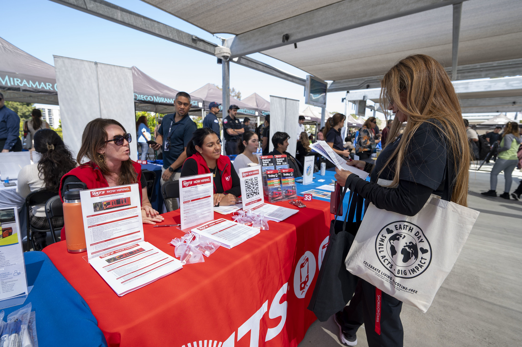 Students stop by a career fair booth.