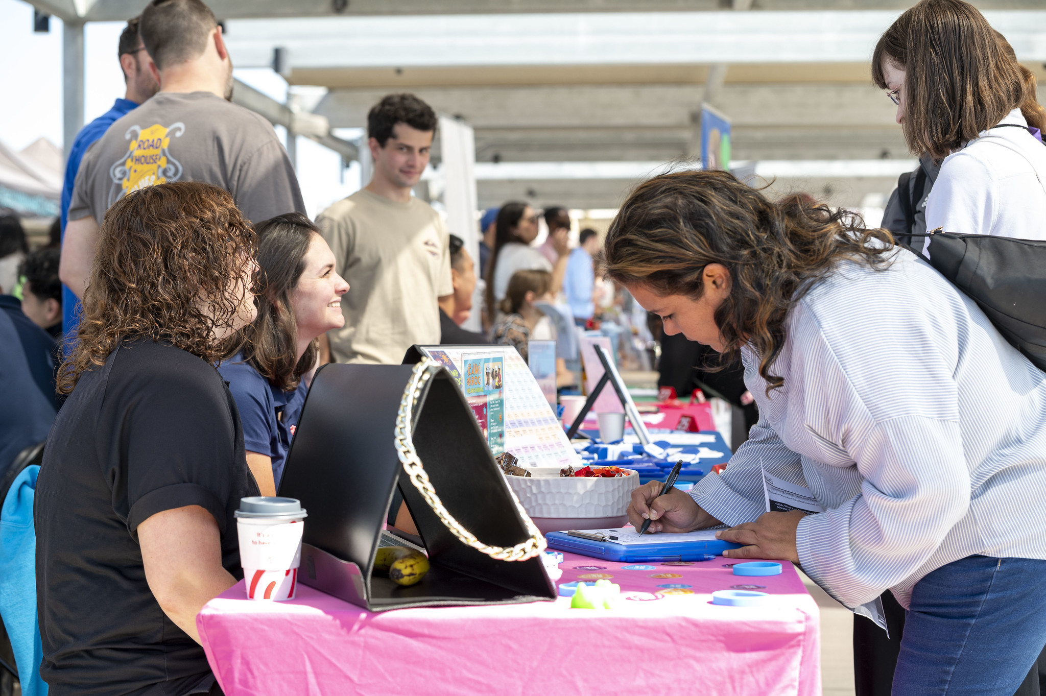 A student stops by a career fair booth.