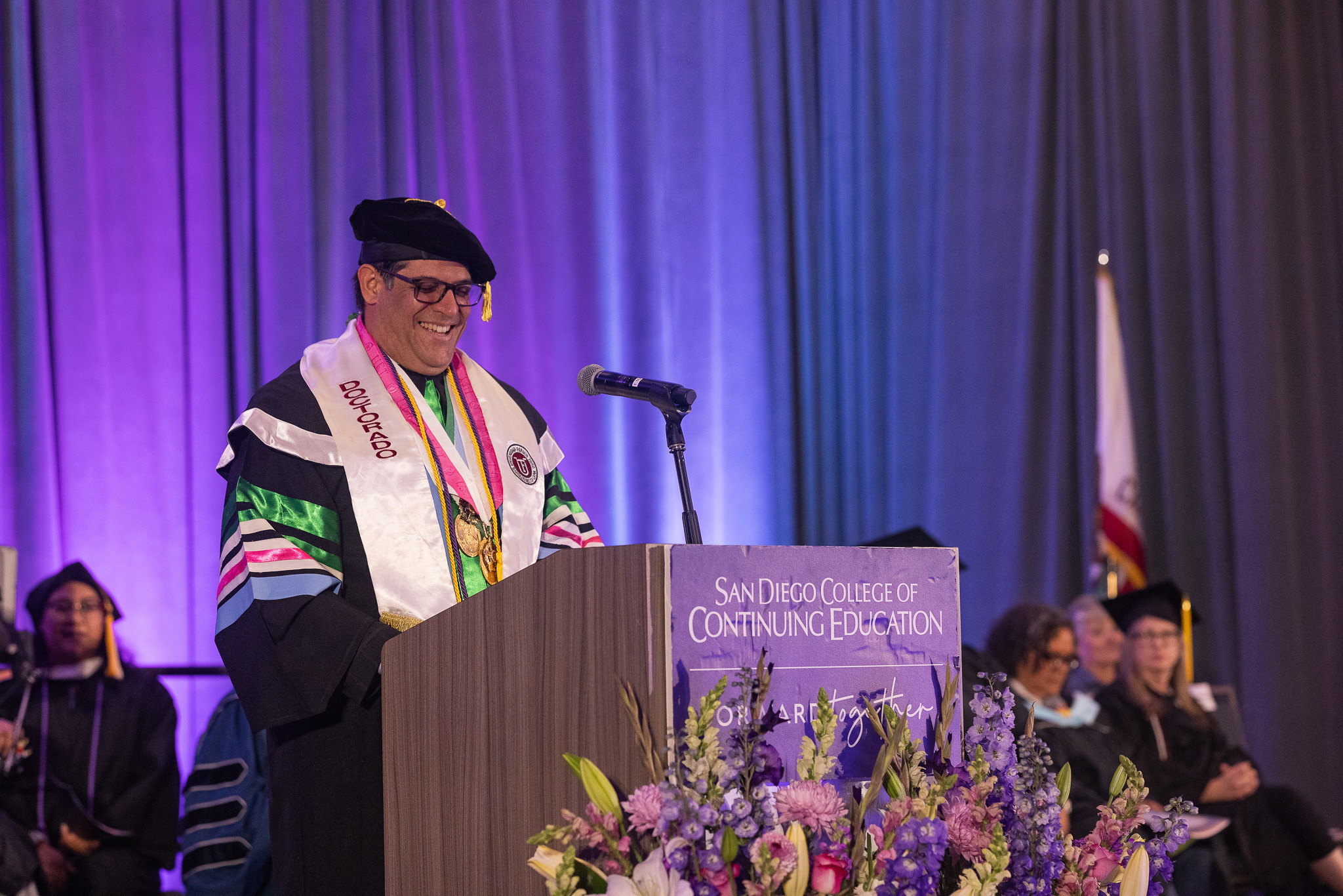Associated Student Government President Yahir Melendez speaks at a podium.