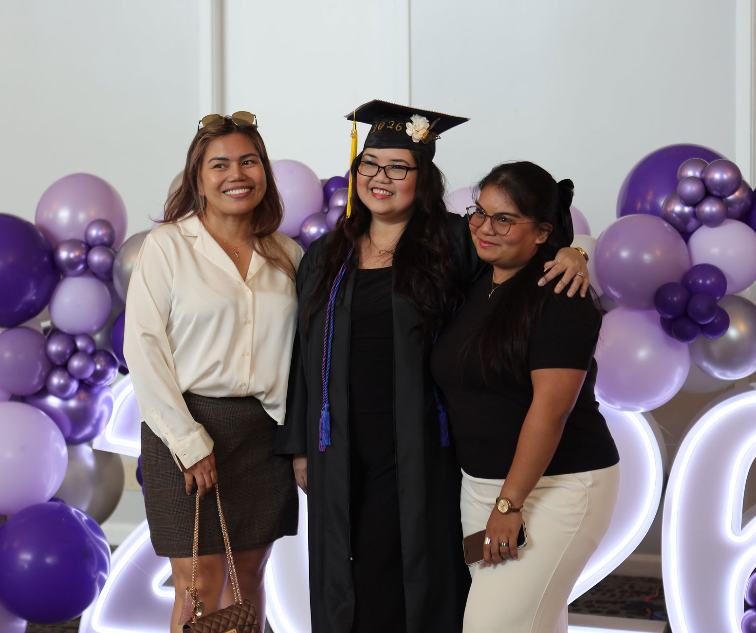A graduate with her family
