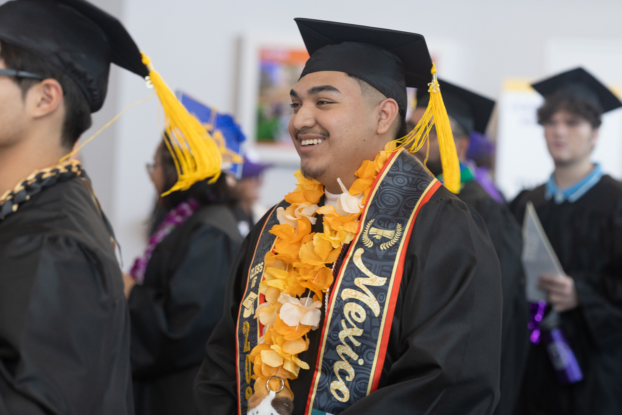 A graduate lines up to head into the ceremony.