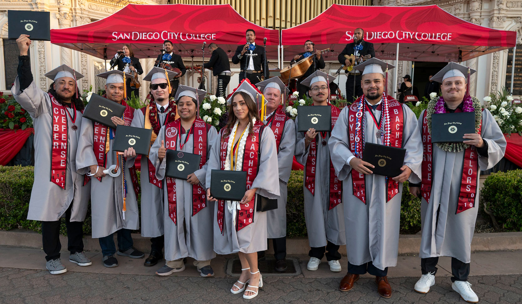 Nine graduates from the City College Cyber Defense bachelor's degree program take a group photo.&nbsp;