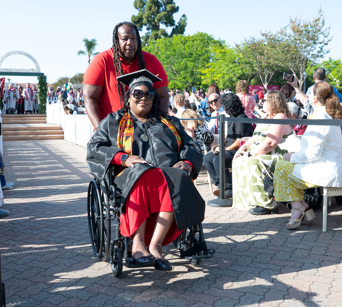 A graduate heads to her seat.&nbsp;