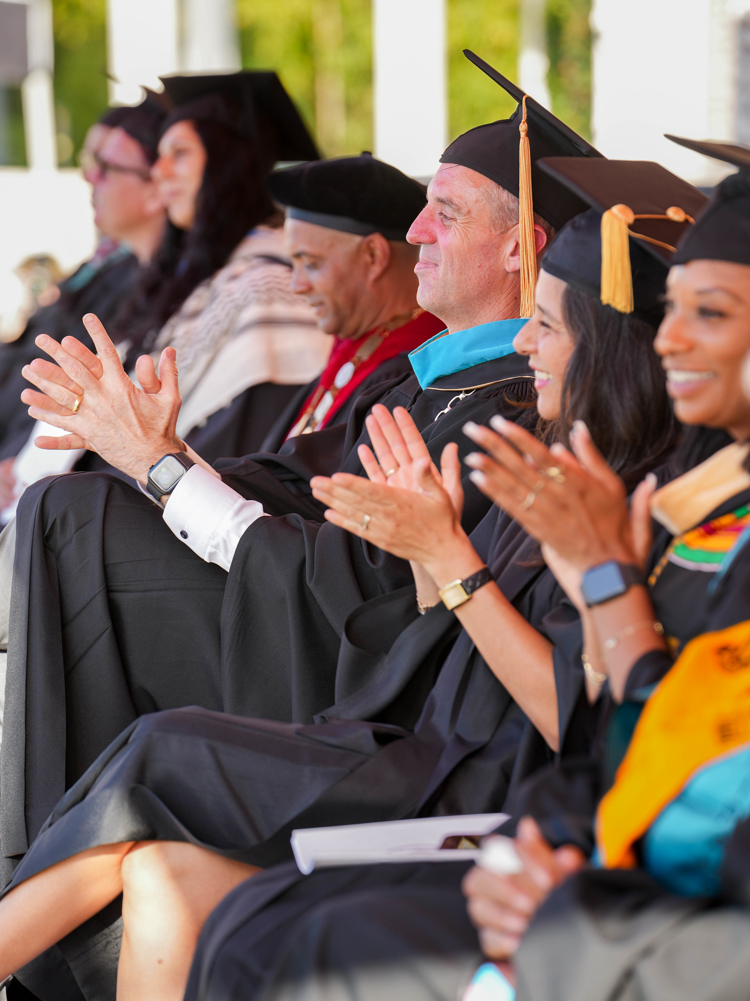 City College President Ricky Shabazz, Chancellor Gregory Smith, and trustees Geysil Arroyo and Mariah Jameson seated on stage.&nbsp;