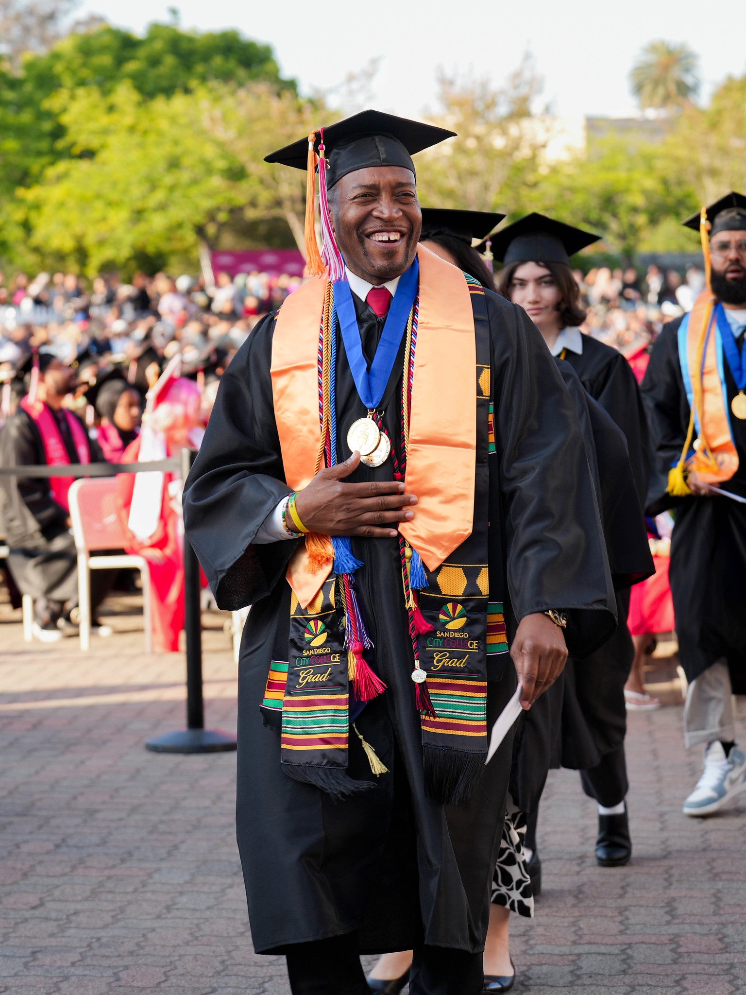An honors graduate heads to his seat.&nbsp;