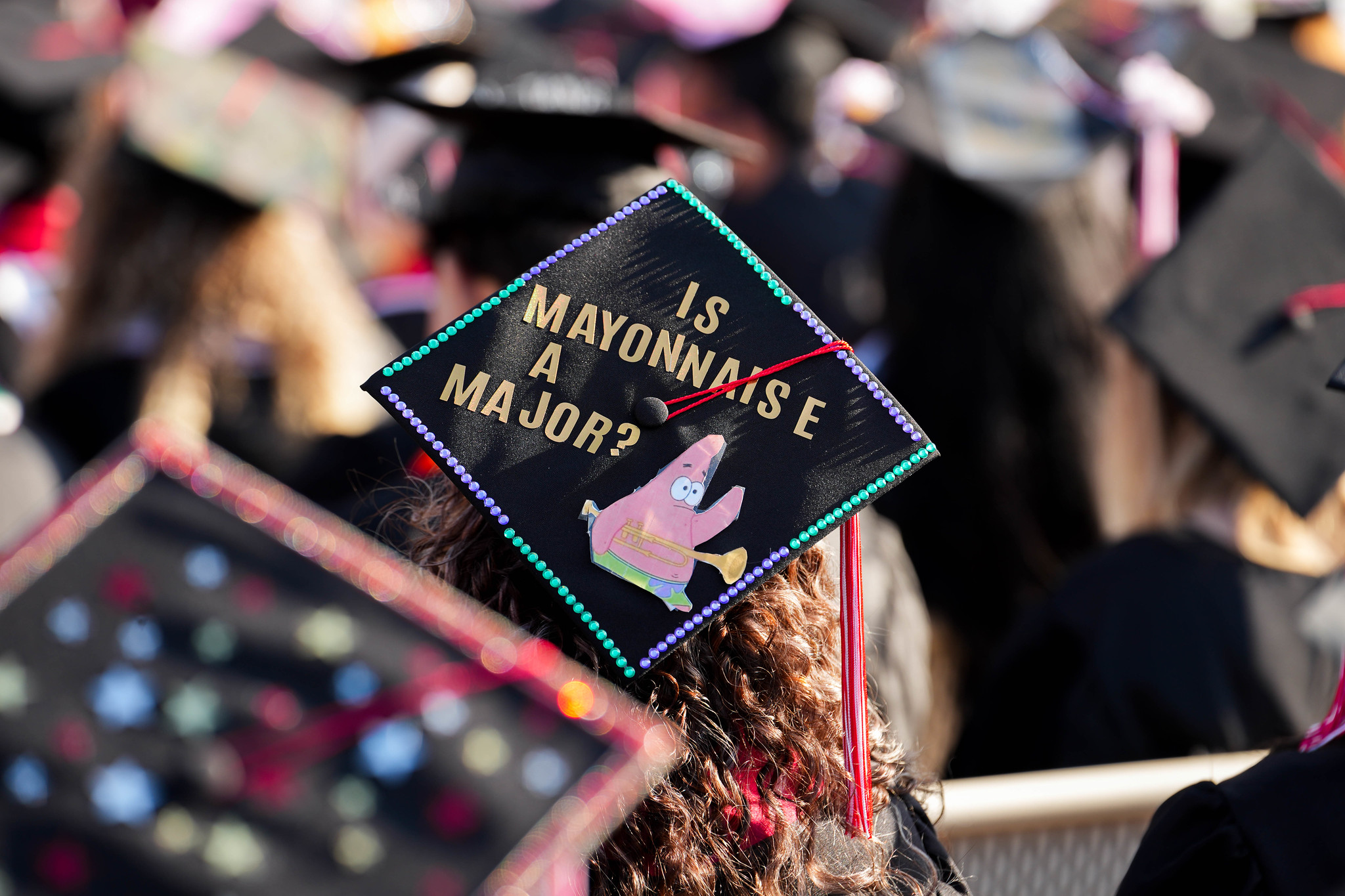 A graduation cap with a picture of Patrick Star from Spongebob. Text reads Is Mayonnaise a Major.&nbsp;