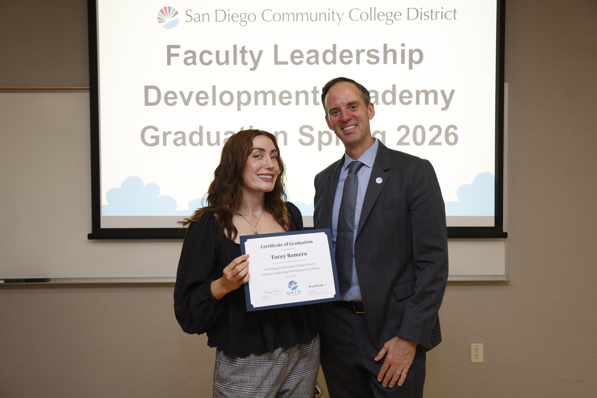Tory Romero with Chancellor Gregory Smith at the academy certificate presentation.