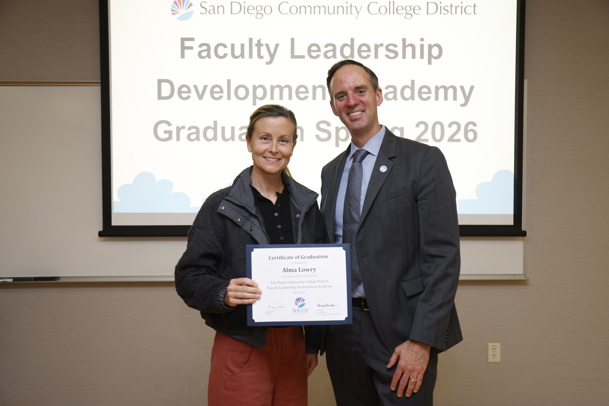 Alma Lowry with Chancellor Gregory Smith at the academy certificate presentation.