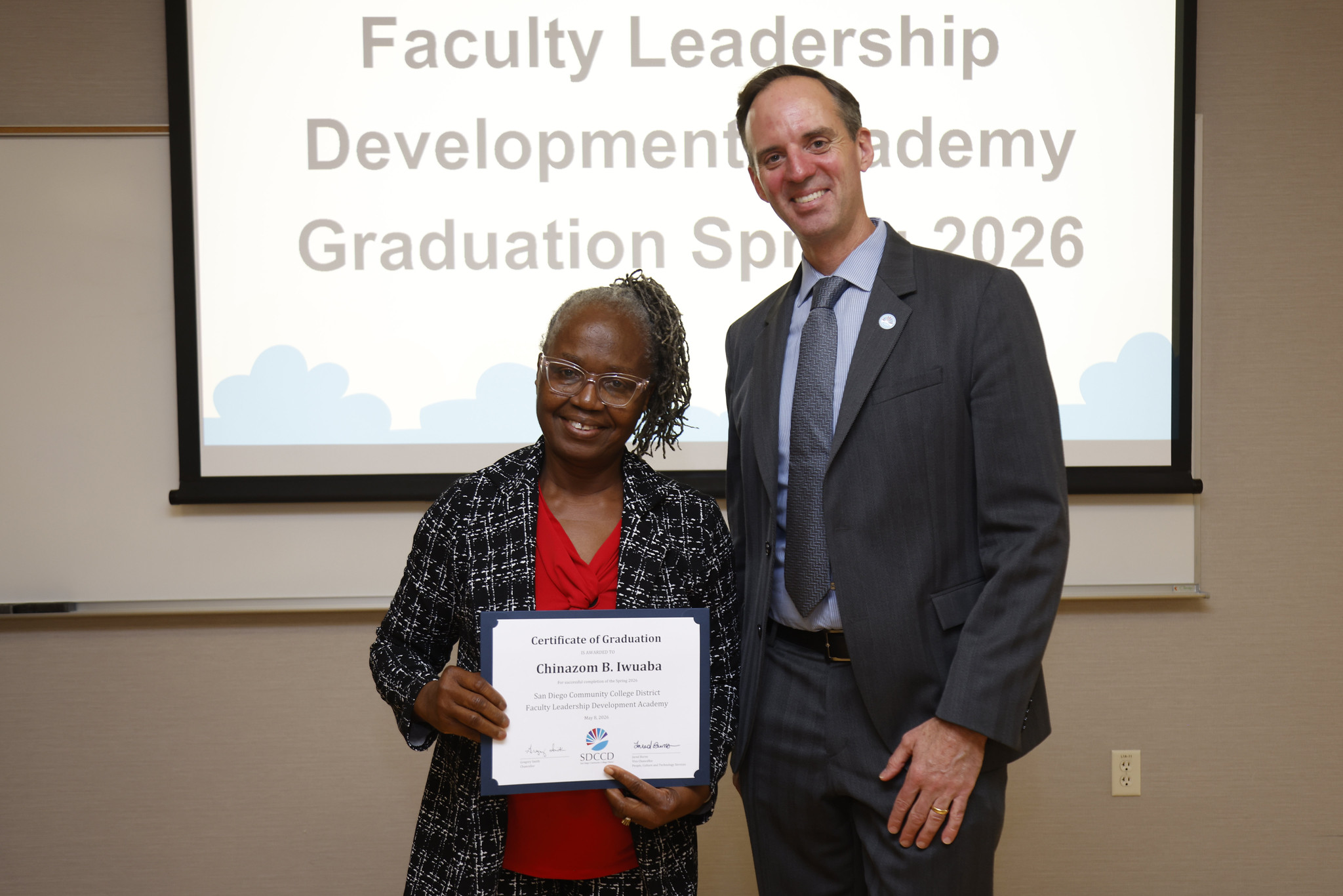 Chinazom B. Iwuaba with Chancellor Gregory Smith at the academy certificate presentation.