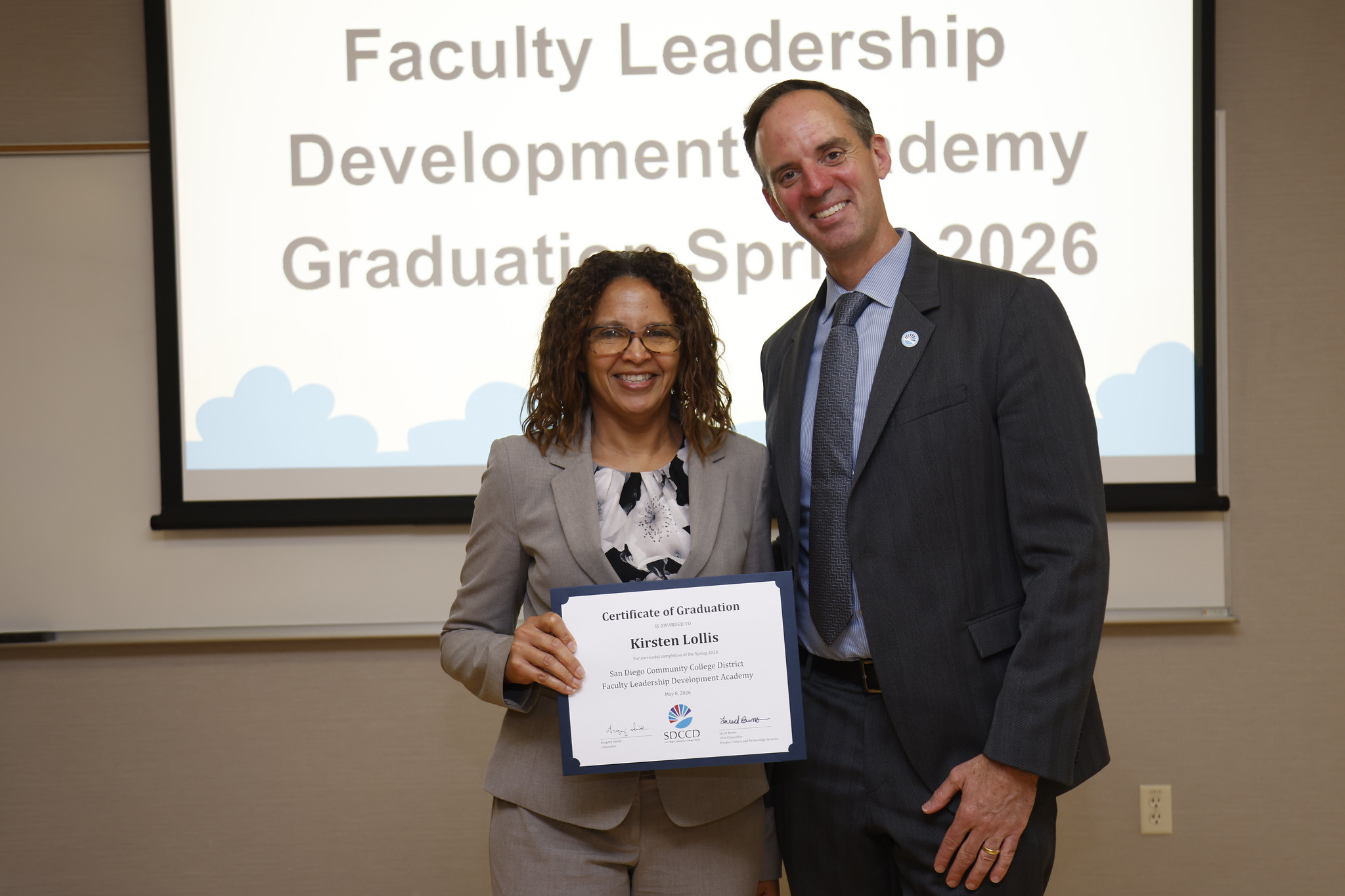 Kirsten Lollis with Chancellor Gregory Smith at the academy certificate presentation.
