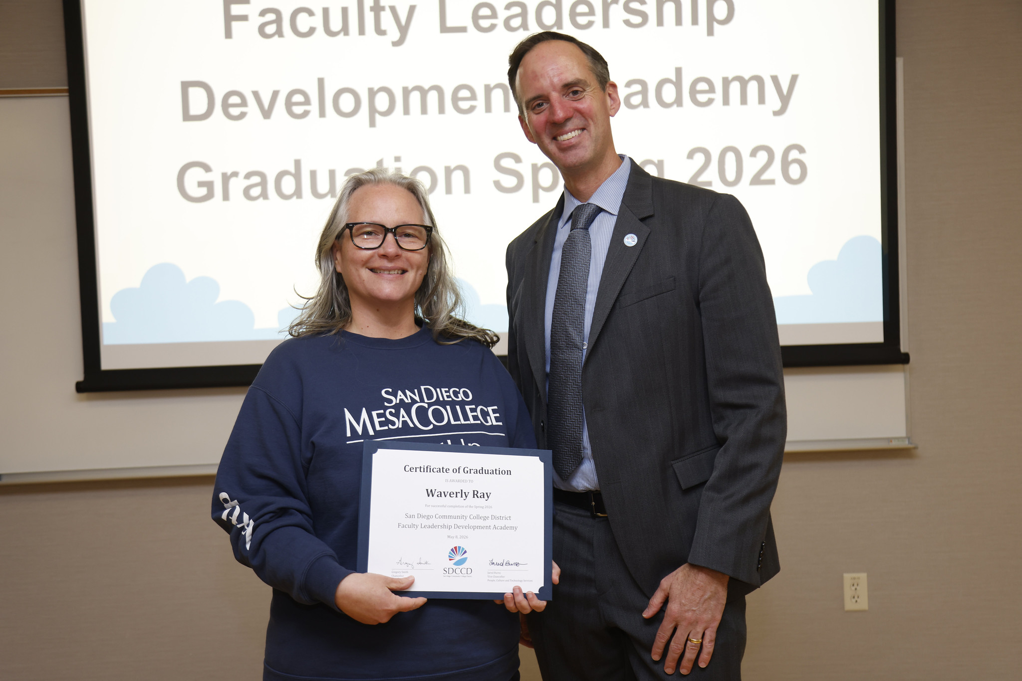 Waverly Ray with Chancellor Gregory Smith at the academy certificate presentation.