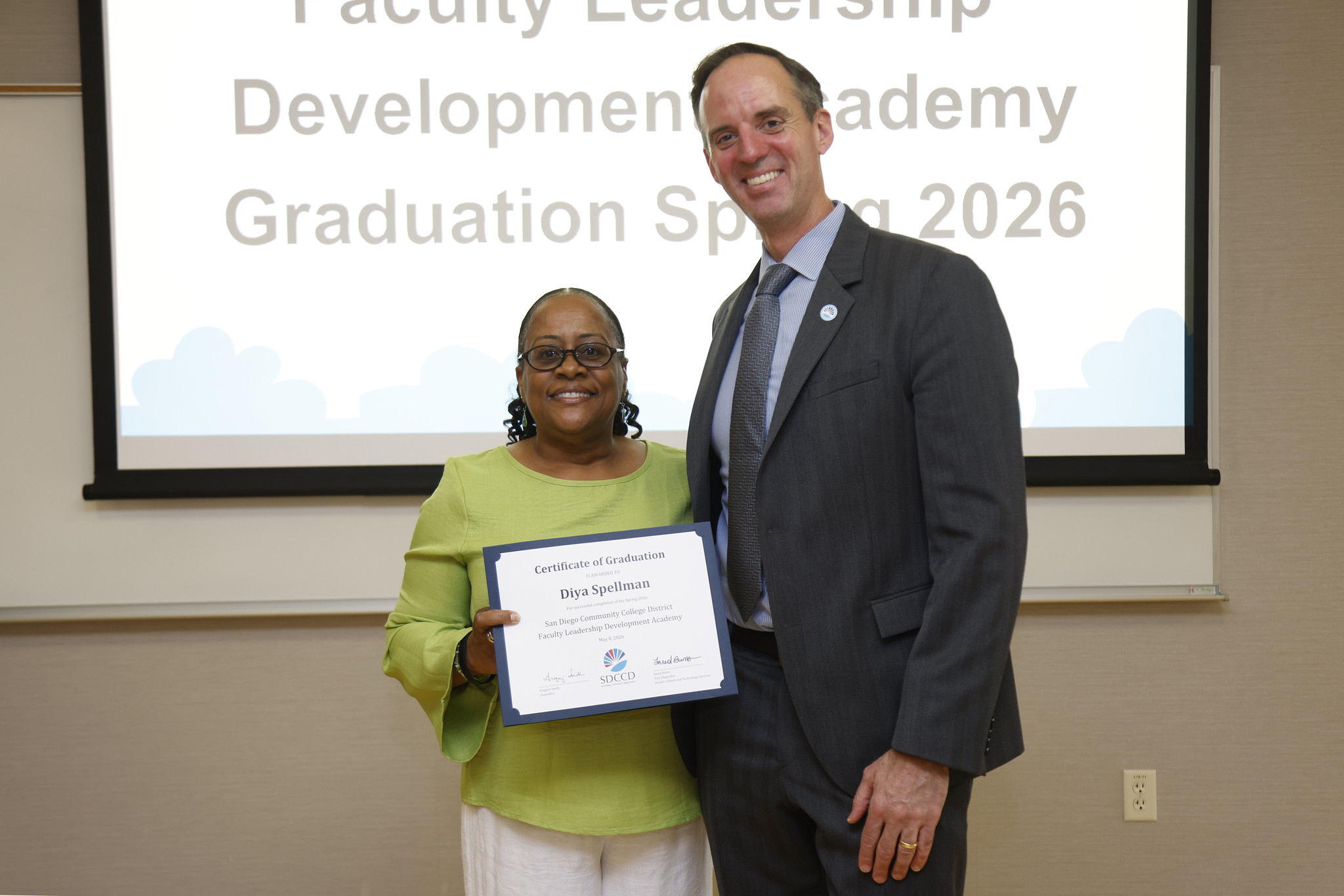 Diya Spellman with Chancellor Gregory Smith at the academy certificate presentation.