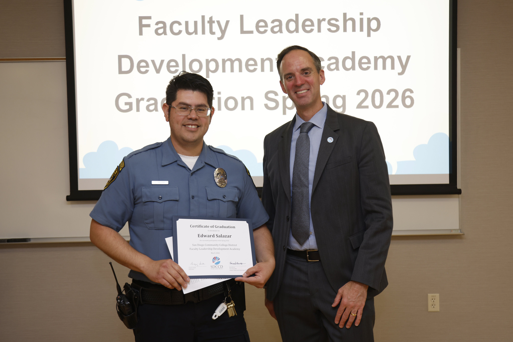 Edward Salazar with Chancellor Gregory Smith at the academy certificate presentation.