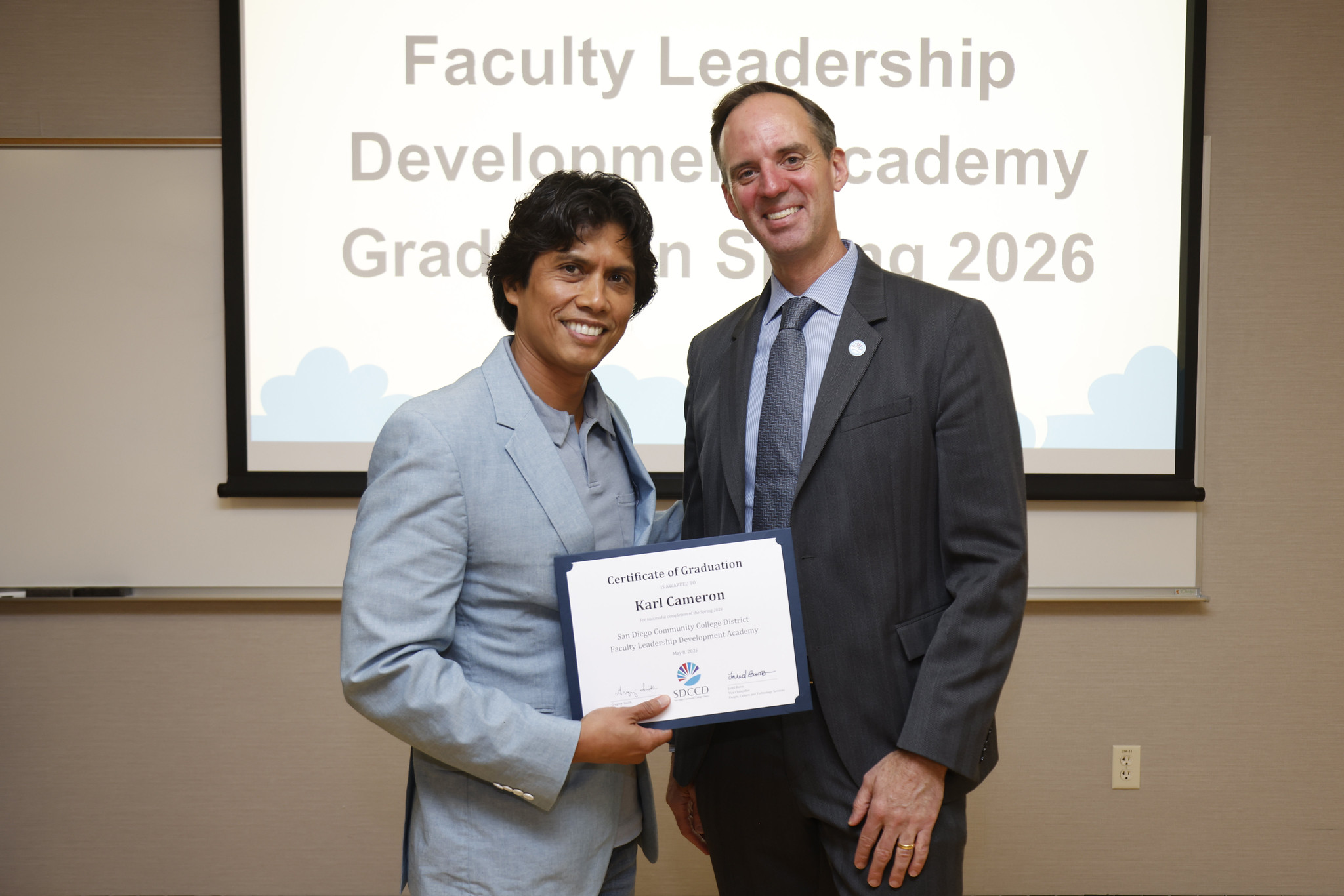 Karl Cameron with Chancellor Gregory Smith at the academy certificate presentation.