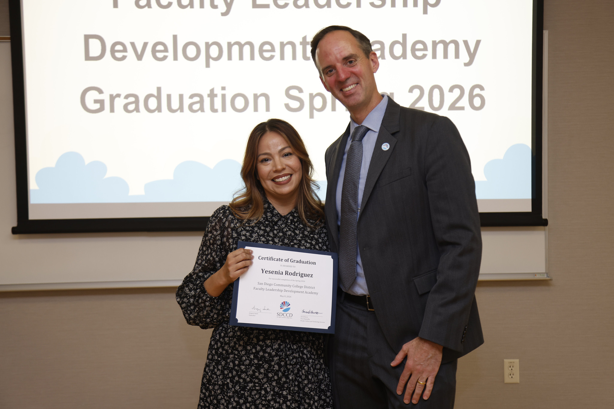 Yesenia Rodriguez with Chancellor Gregory Smith at the academy certificate presentation.