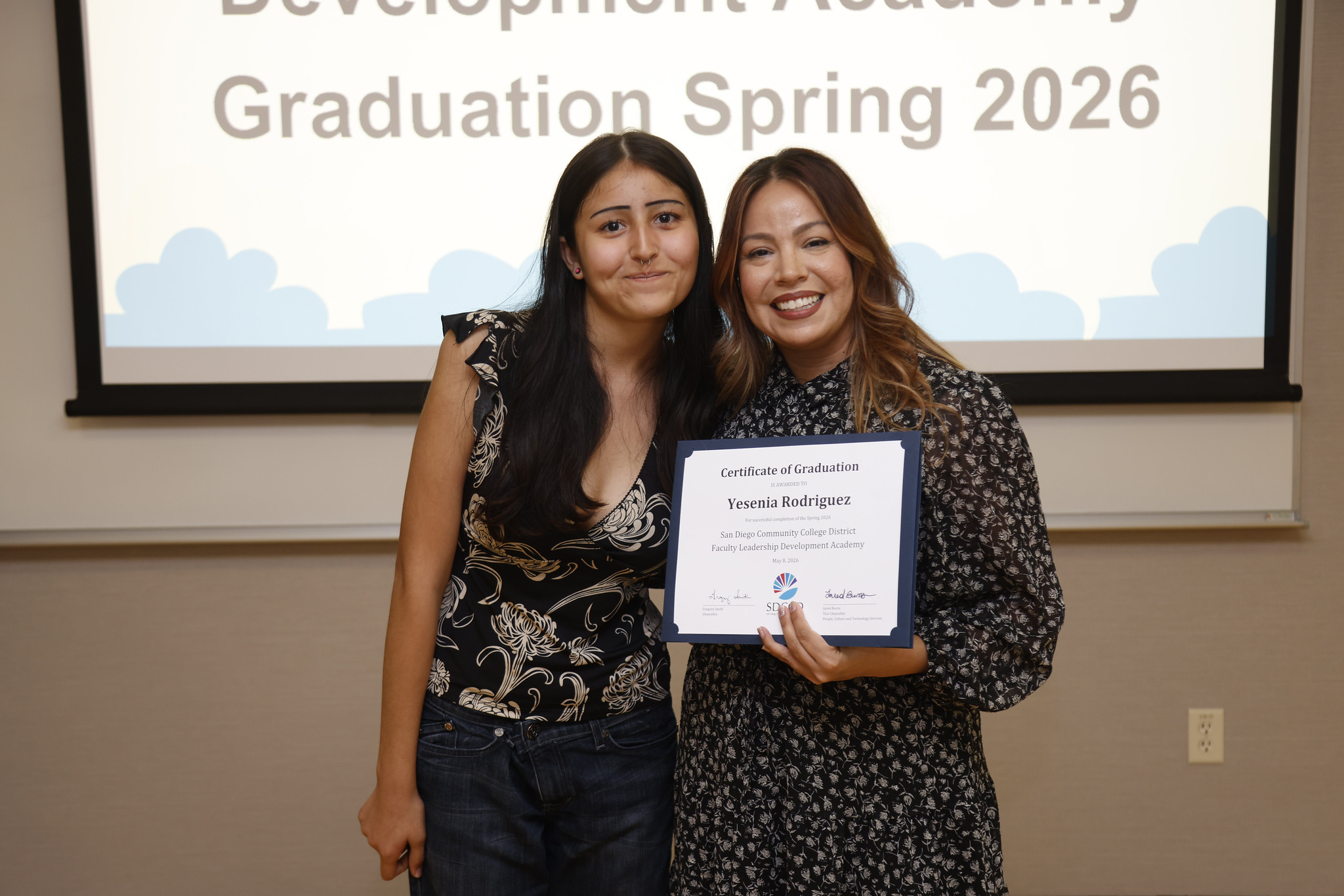 Yesenia Rodriguez and a guest at the academy certificate presentation.