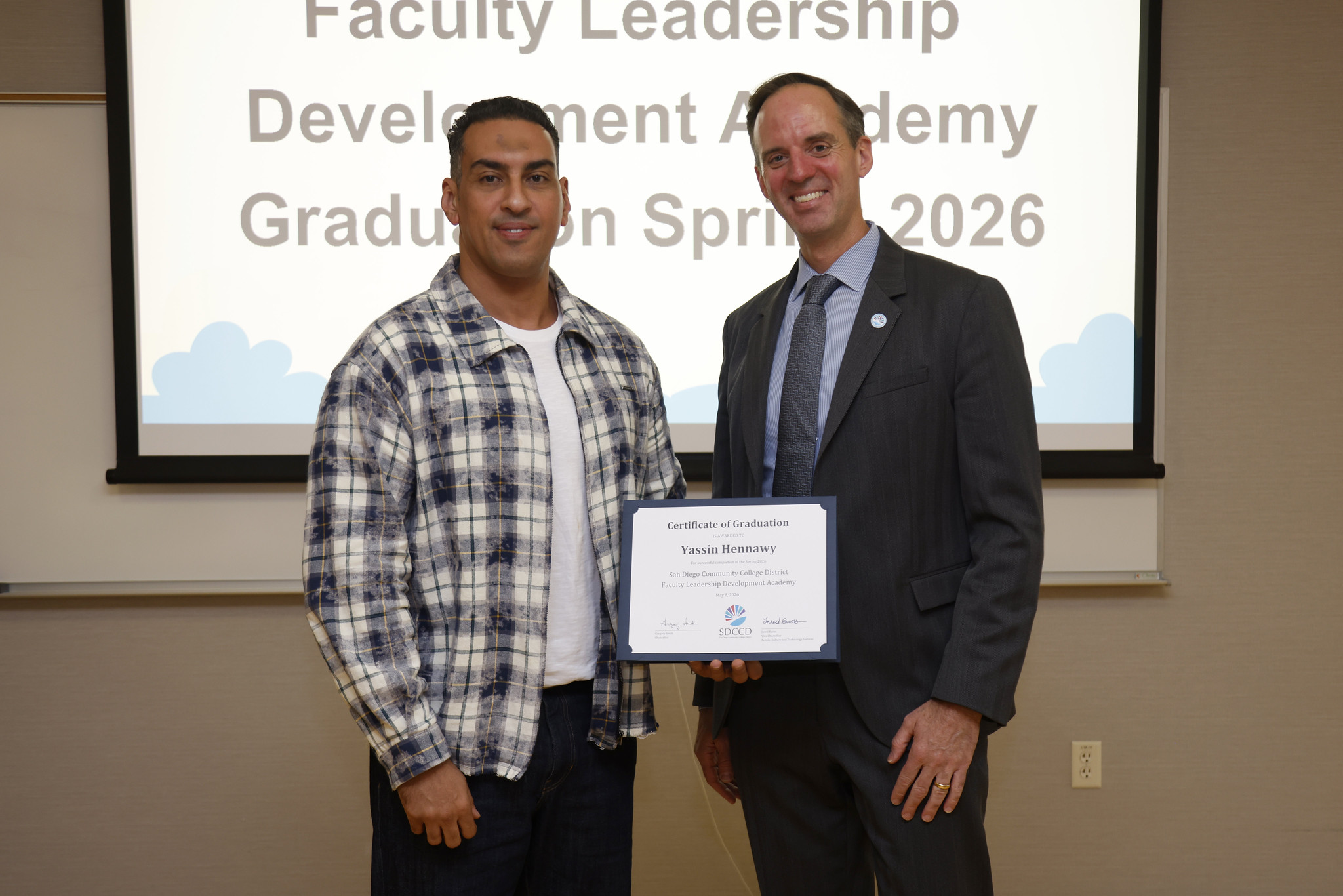 Yassin Hennawy with Chancellor Gregory Smith at the academy certificate presentation.