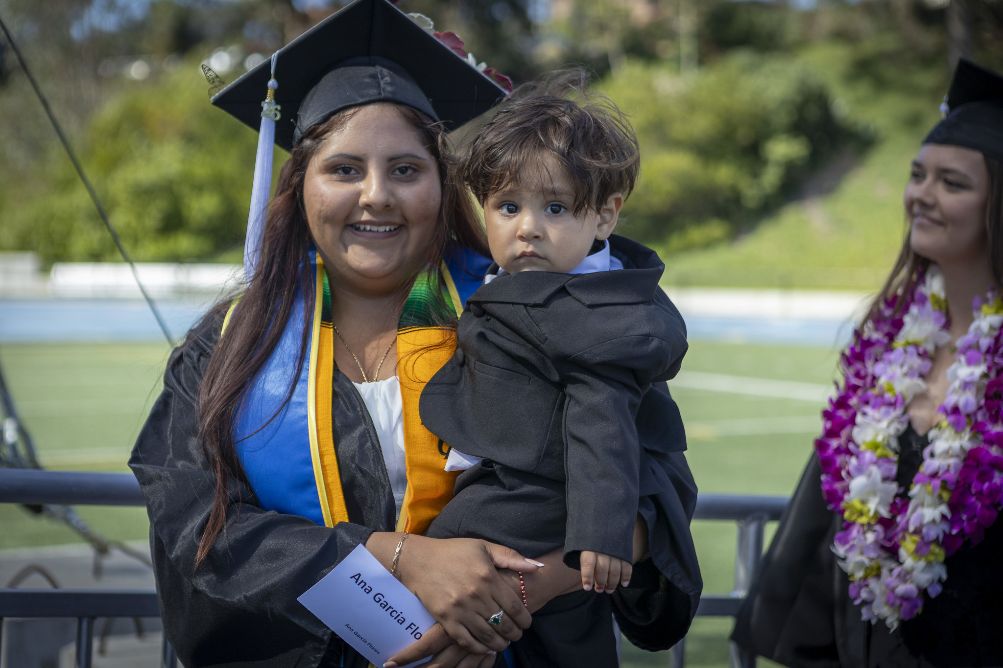 A grad heads to her seat.&nbsp;