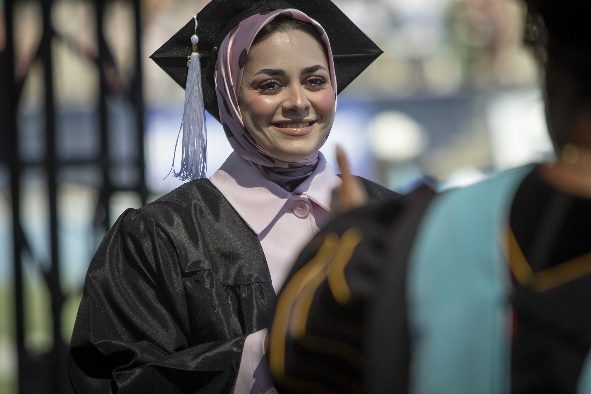 A graduate crossing the stage.&nbsp;