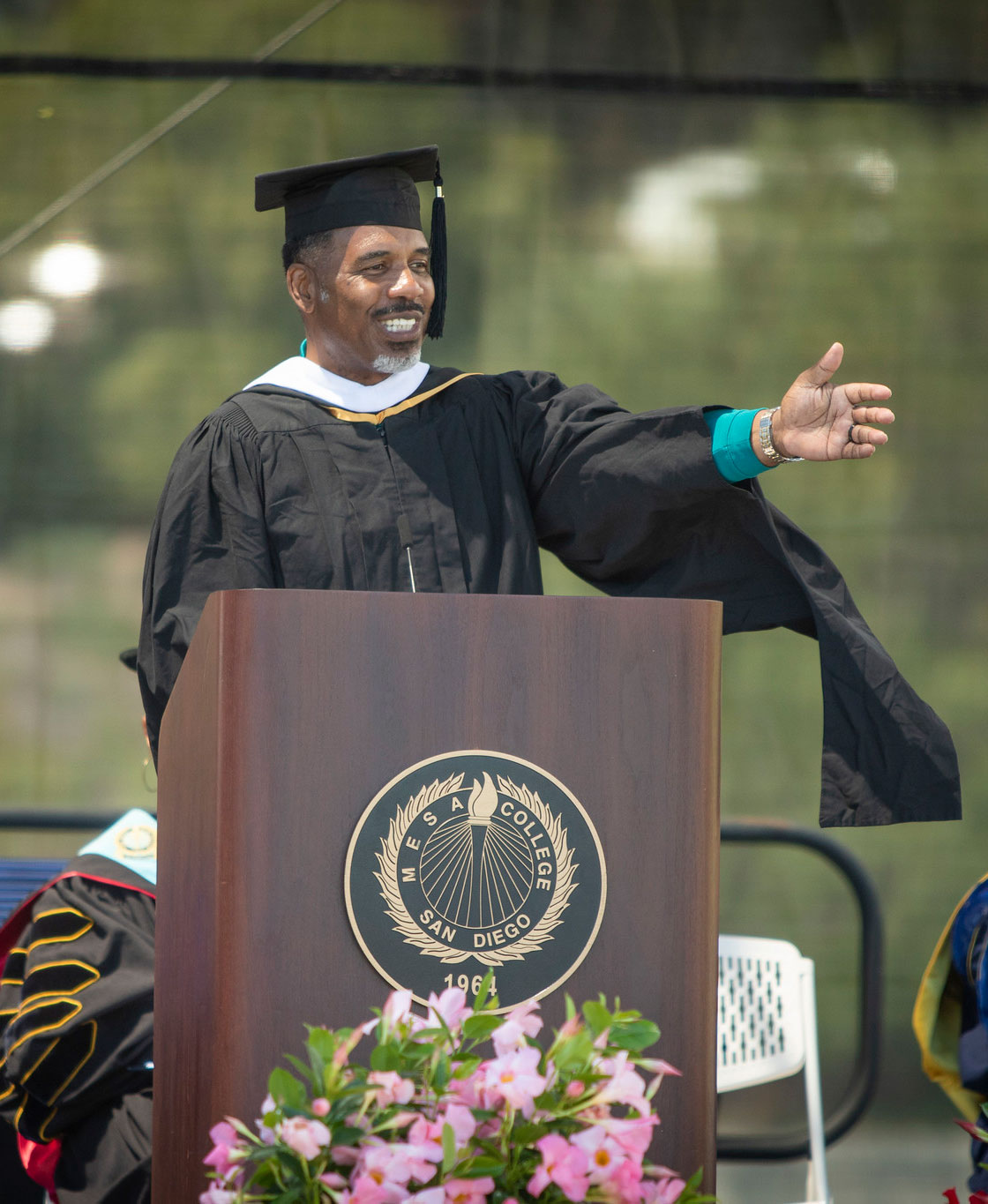 Vice President, Student Services Larry Maxey speaks at a podium.