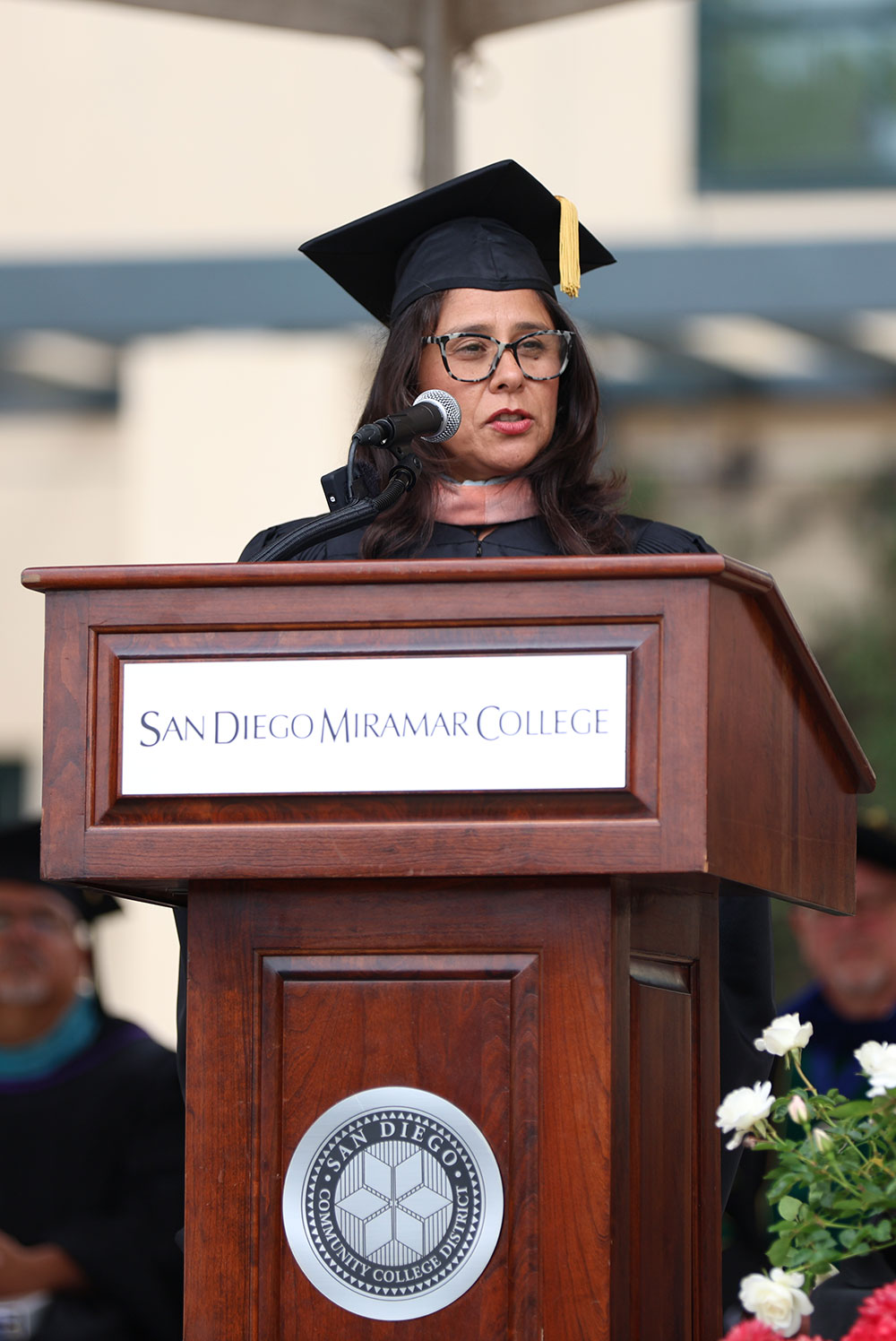 Board of Trustees President Geysil Arroyo speaks at commencement.&nbsp;