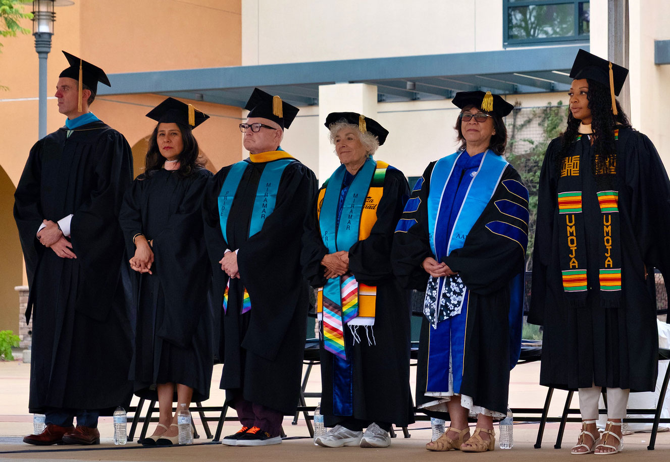 The Chancellor and five trustees on stage at commencement.