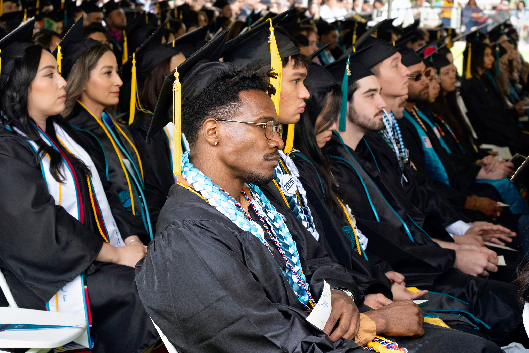 Graduates seated in the audience.