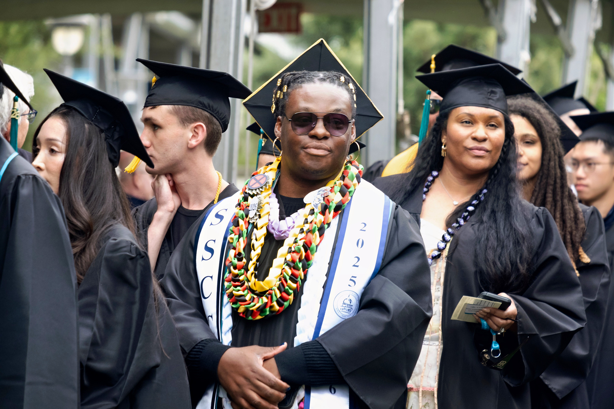Graduate X Ruiz heads to their seat.