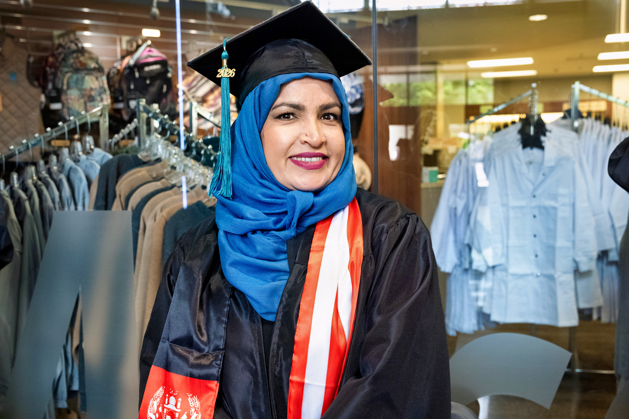 A graduate waiting for the ceremony to begin.&nbsp;