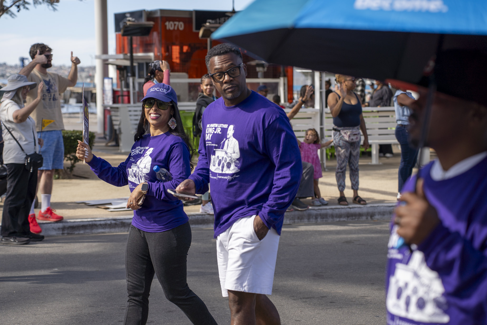 College of Continuing Education President Tina M. King walks in the parade with her husband.